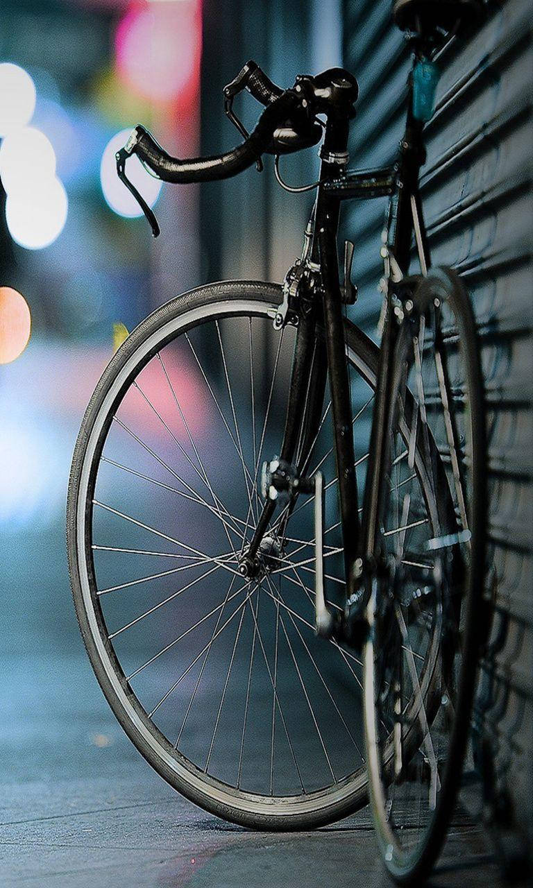 Feel The Breeze And Explore The Open Road With Bicycle Iphone. Background