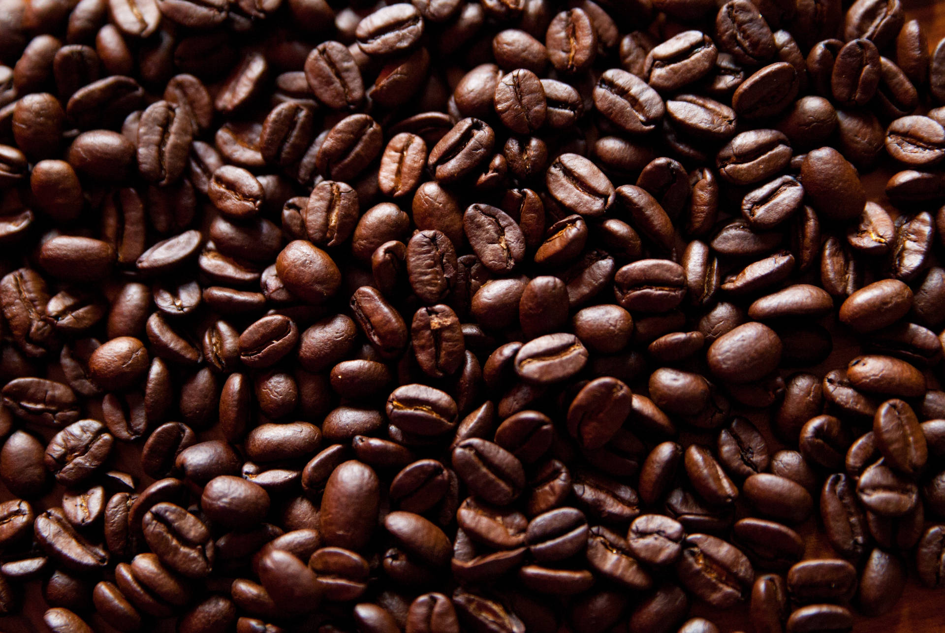 Feel The Power Of Freshly Roasted Coffee Beans Background