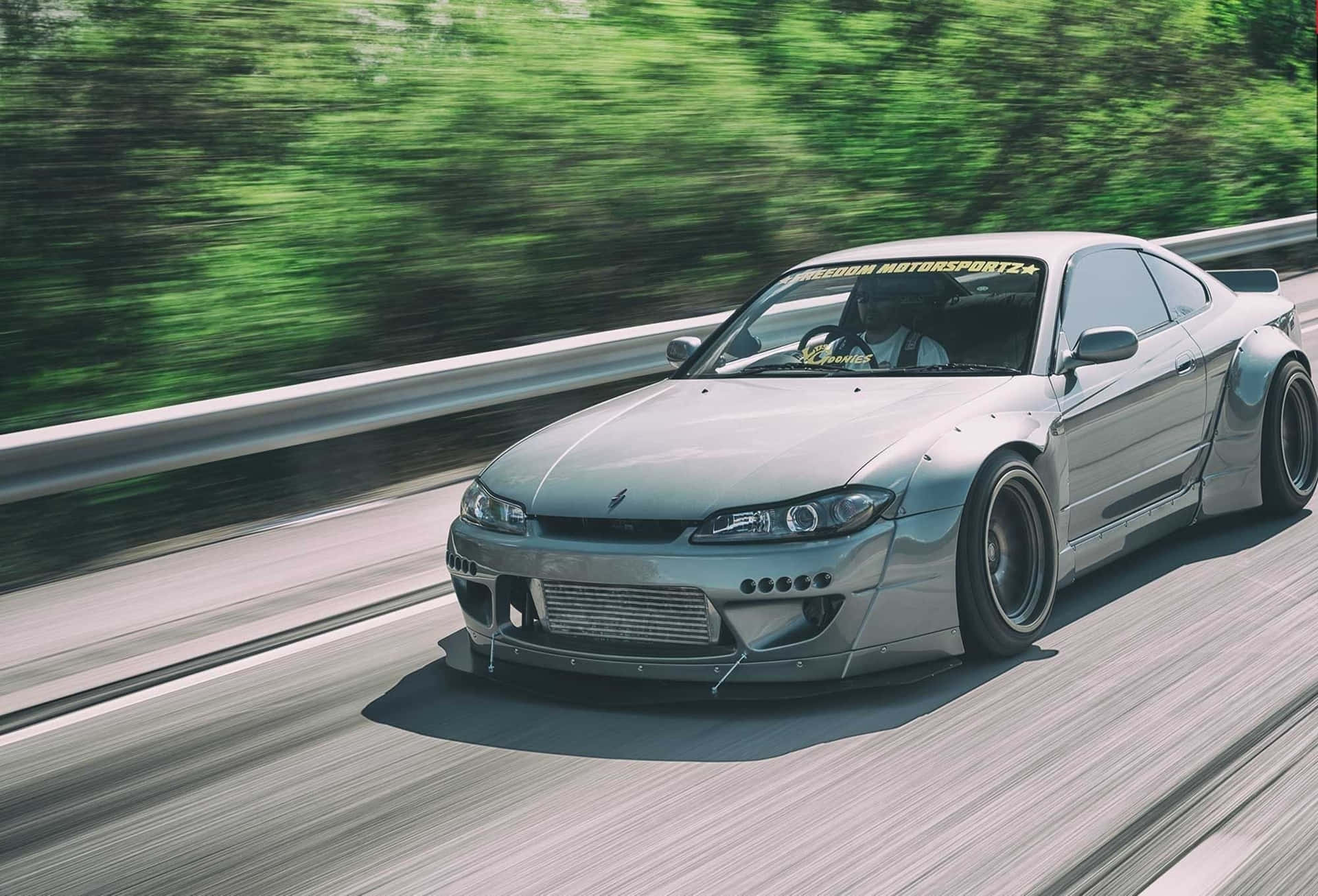 Feel The Power Of Nissan Silvia S15 On The Road Background