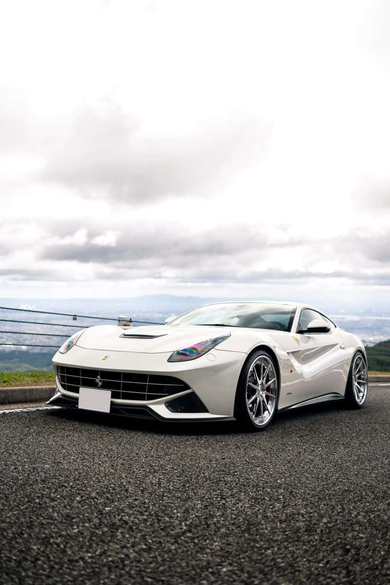 Feel The Wind In Your Hair As You Cruise Down The Highway In This Sleek White Ferrari Background