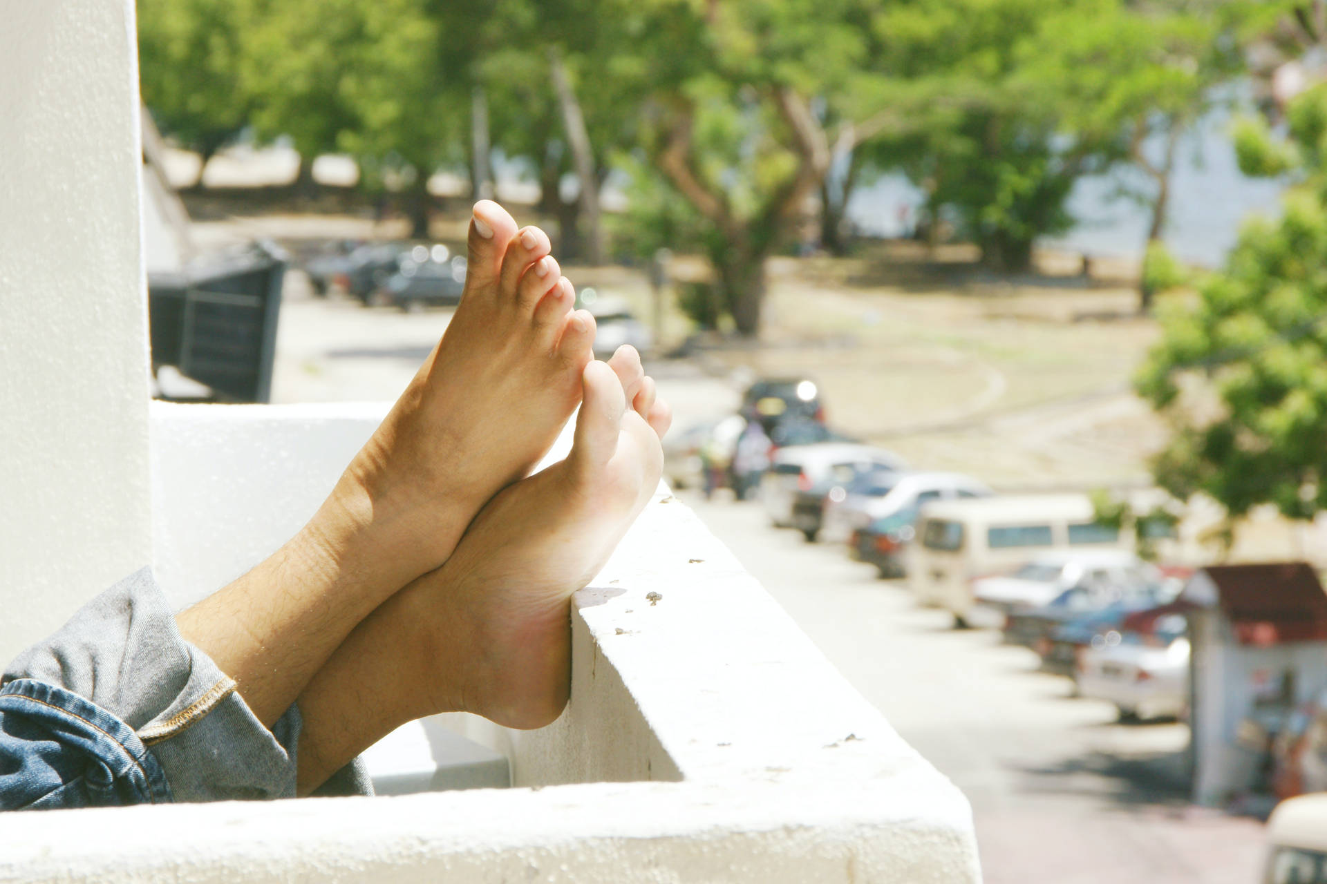 Feet On An Overlooking Balcony Background