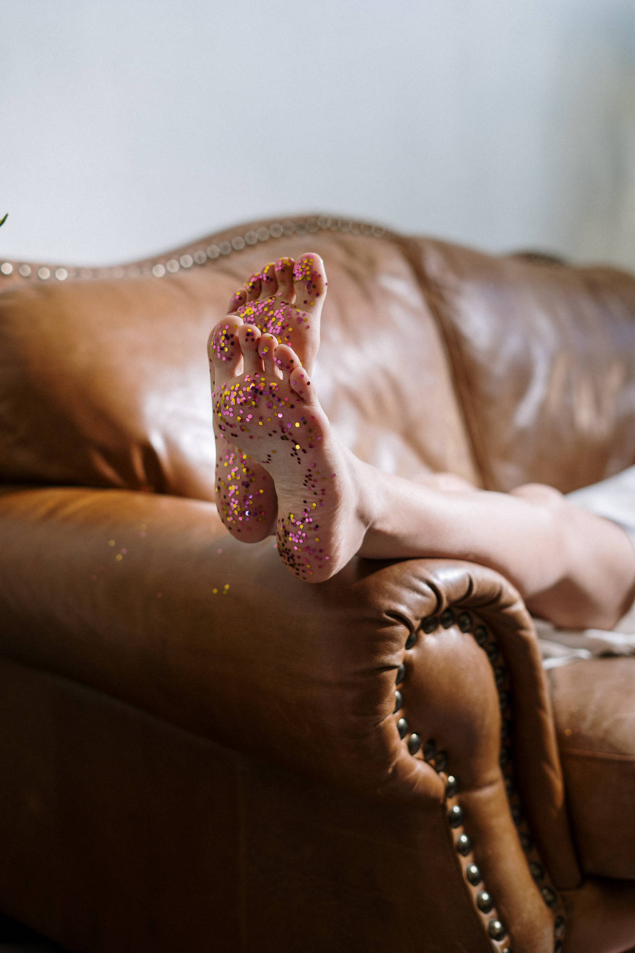 Feet With Colorful Glitters Background