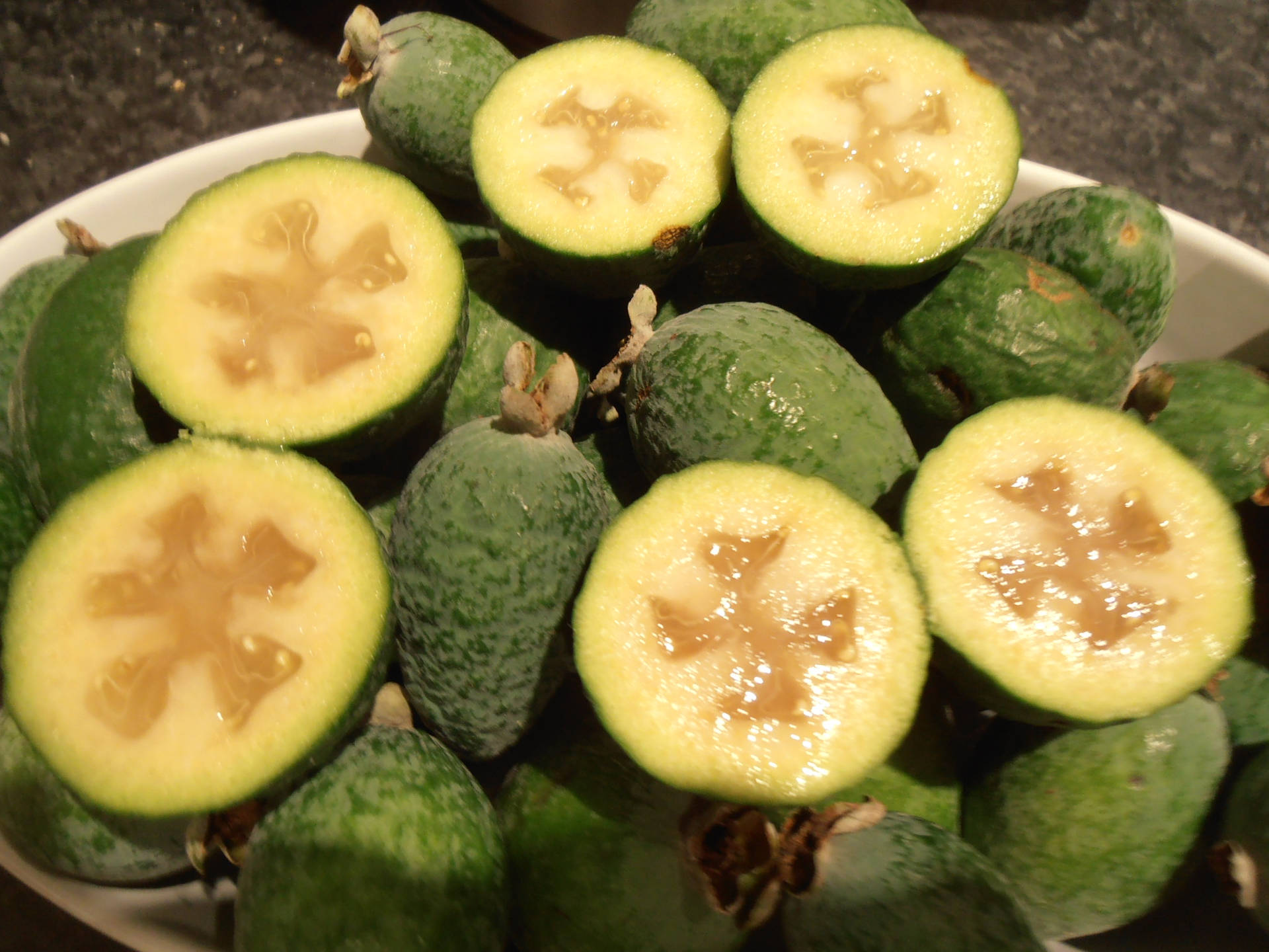 Feijoa In A White Bowl Background