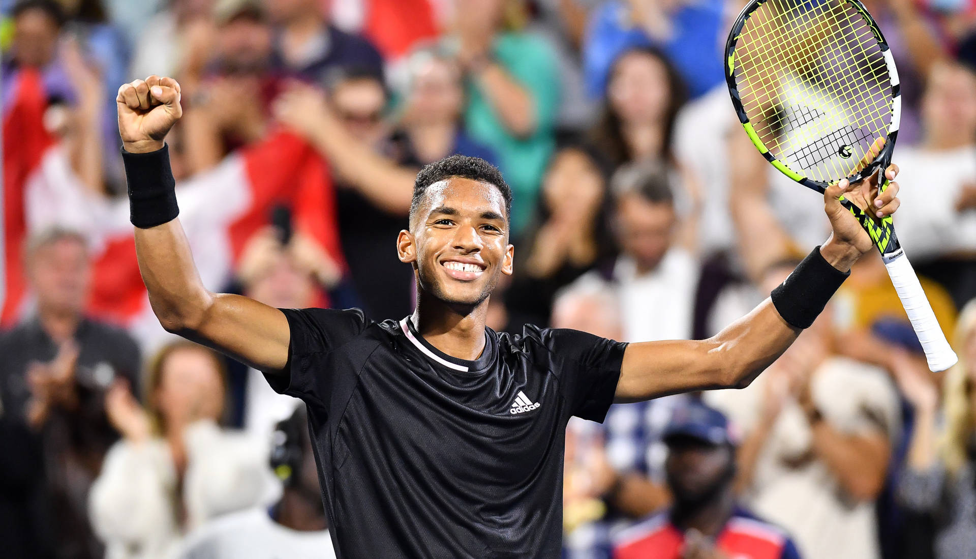 Felix Auger-aliassime Celebrating A Victory Background