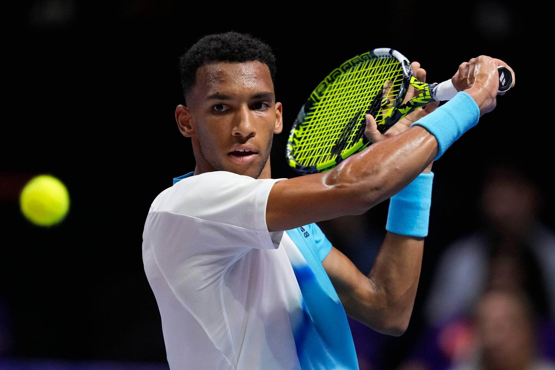 Felix Auger Aliassime Concentrating On The Ball Background