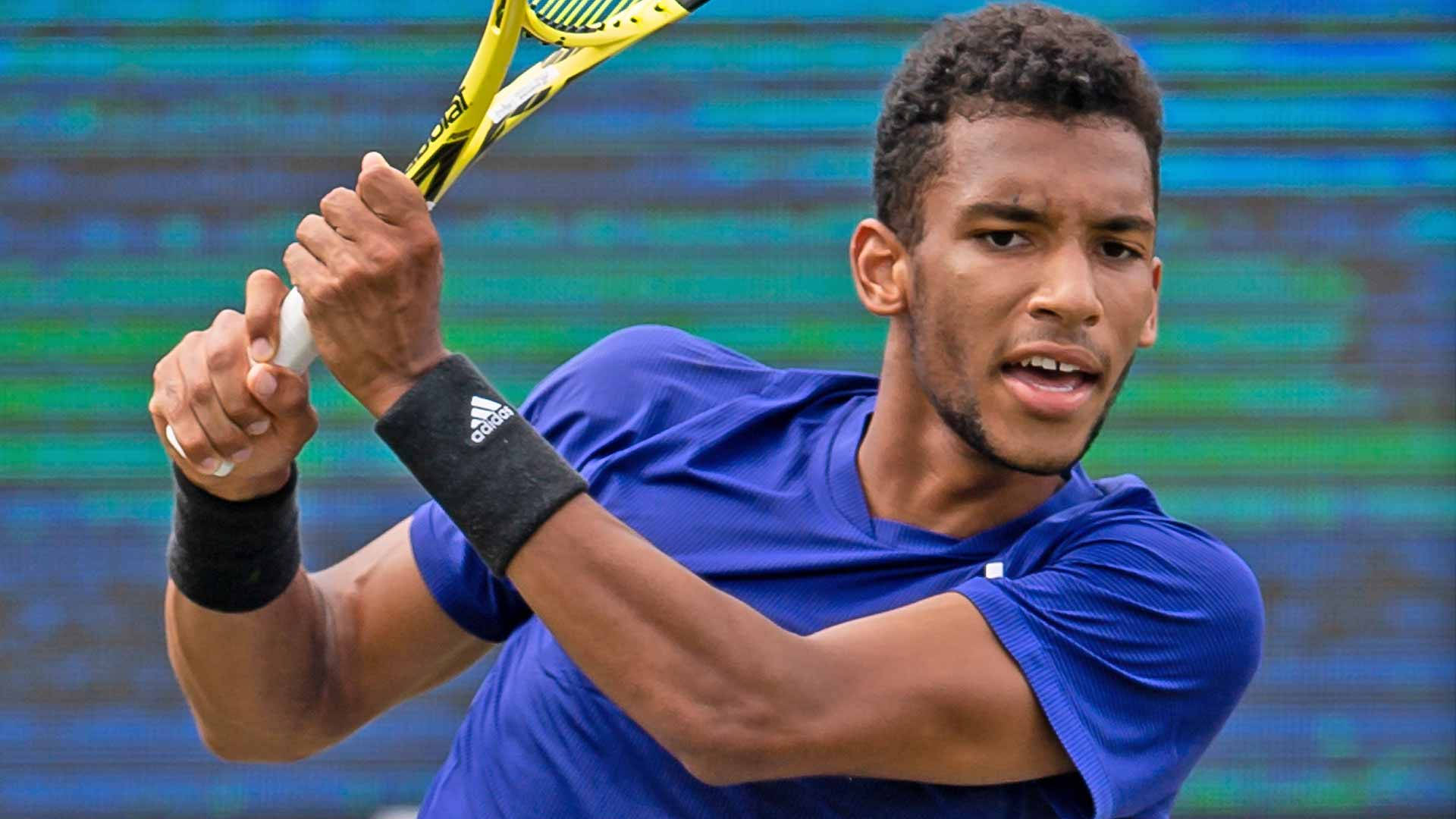 Felix Auger-aliassime Focused During The Game Background