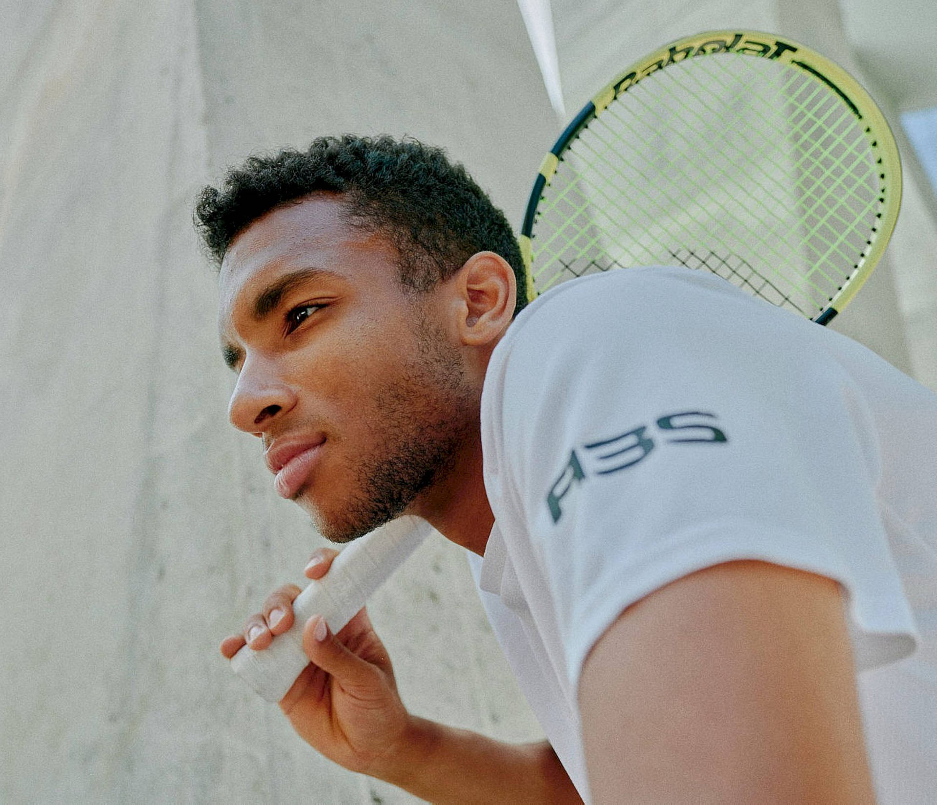 Felix Auger-aliassime In Action On The Tennis Court