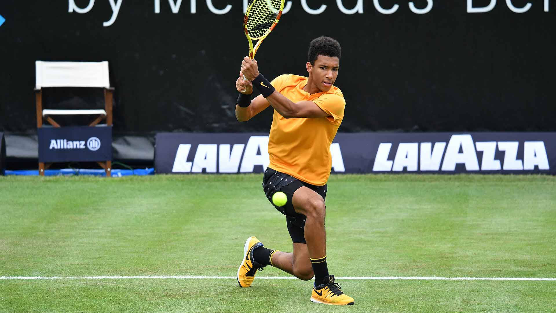 Felix Auger-aliassime In Action On The Tennis Court