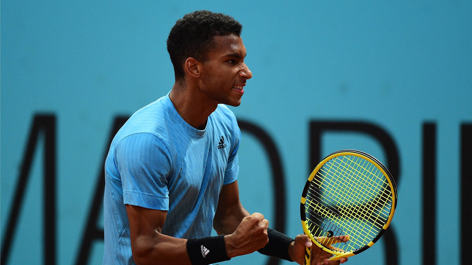 Felix Auger-aliassime In An Ecstatic Fist Pump Celebration Background