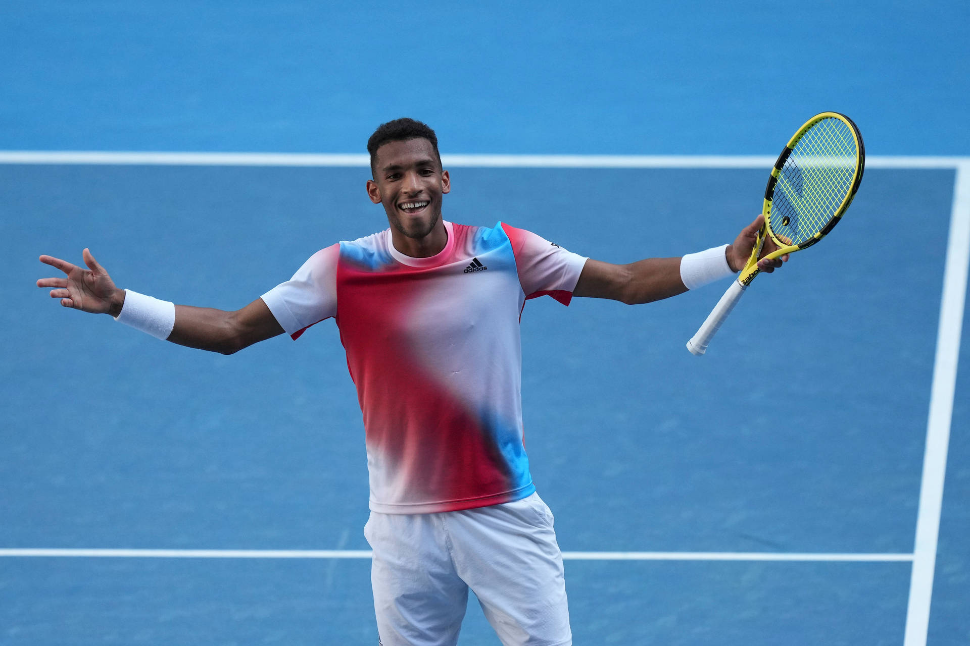 Felix Auger Aliassime Smiling With Arms Open Background