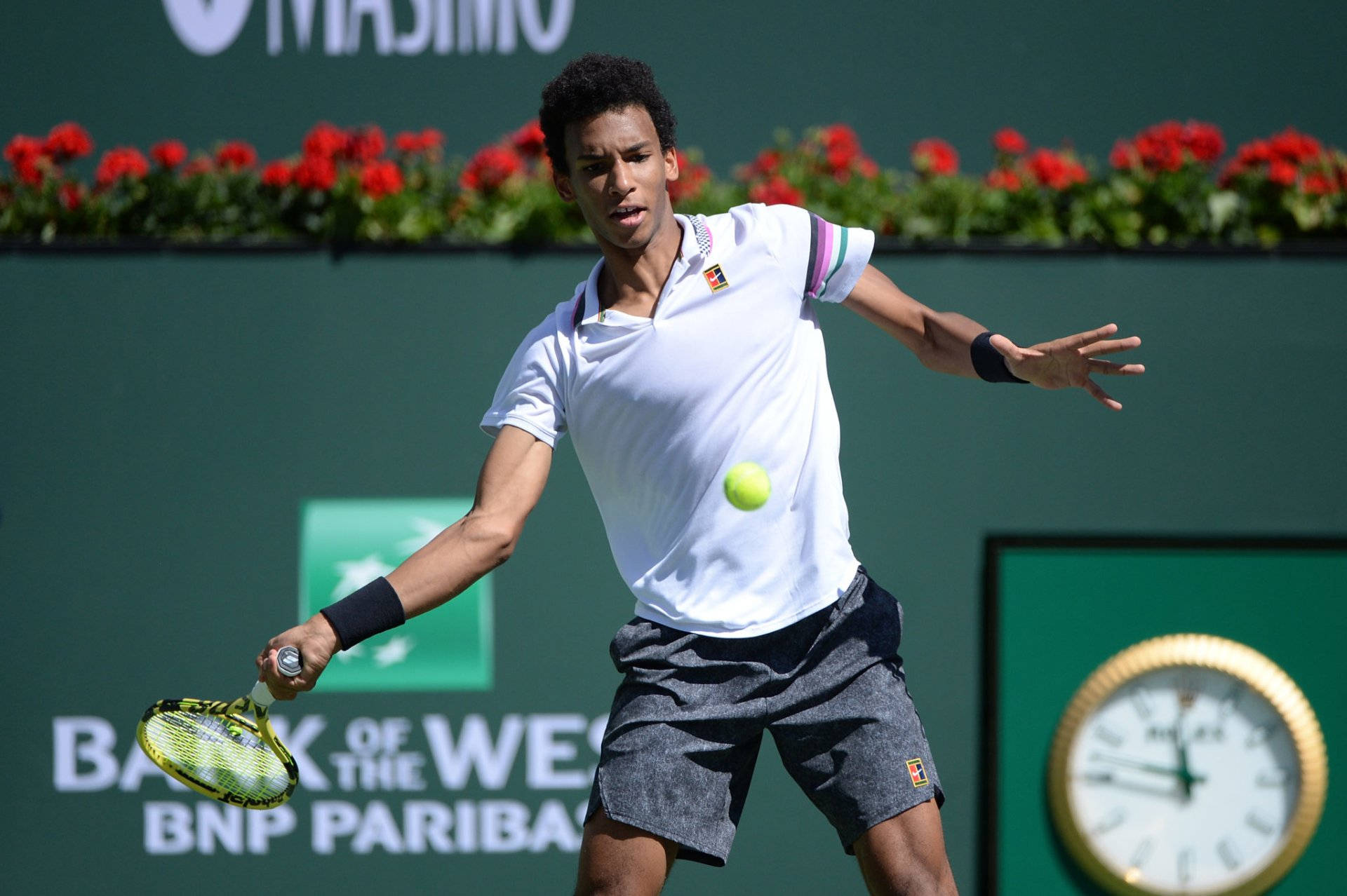 Felix Auger Aliassime Swinging Racket Background