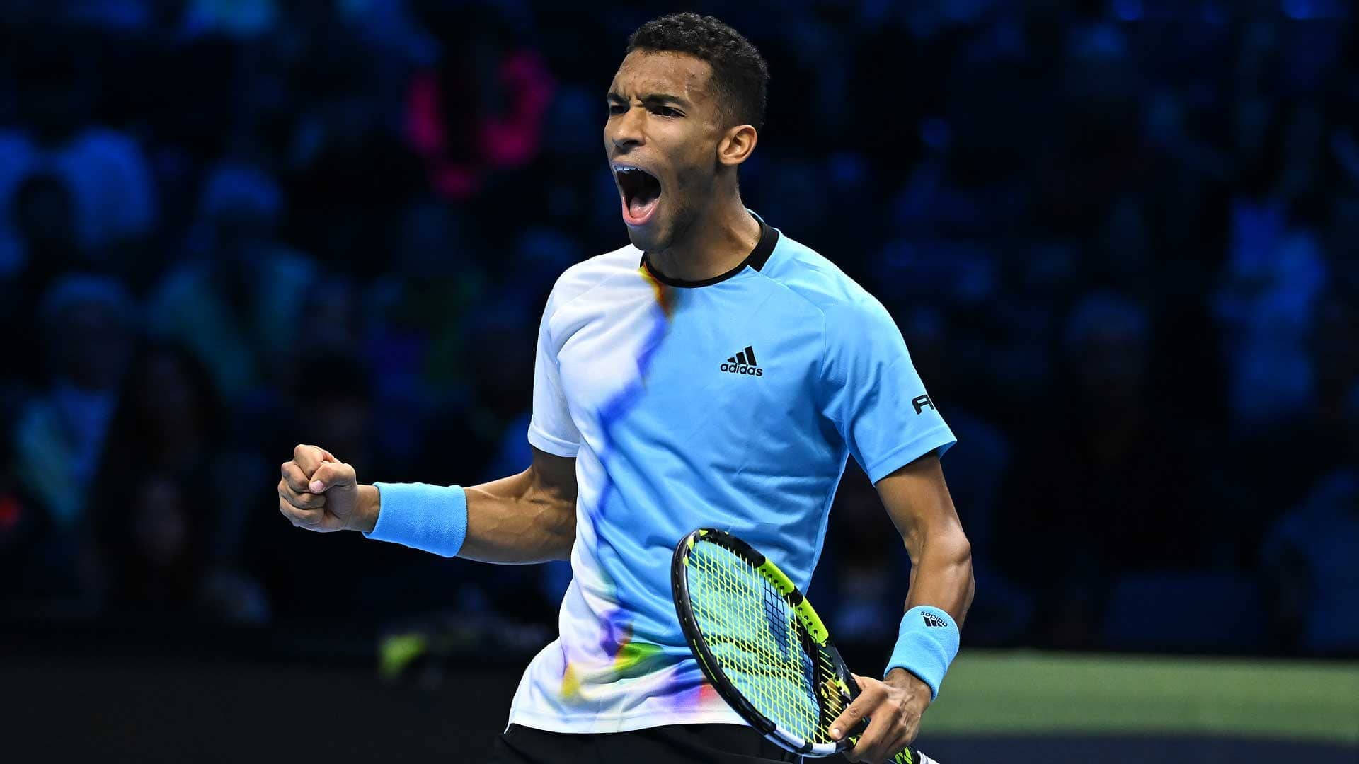 Felix Auger Aliassime Yelling And Fist Pump Background