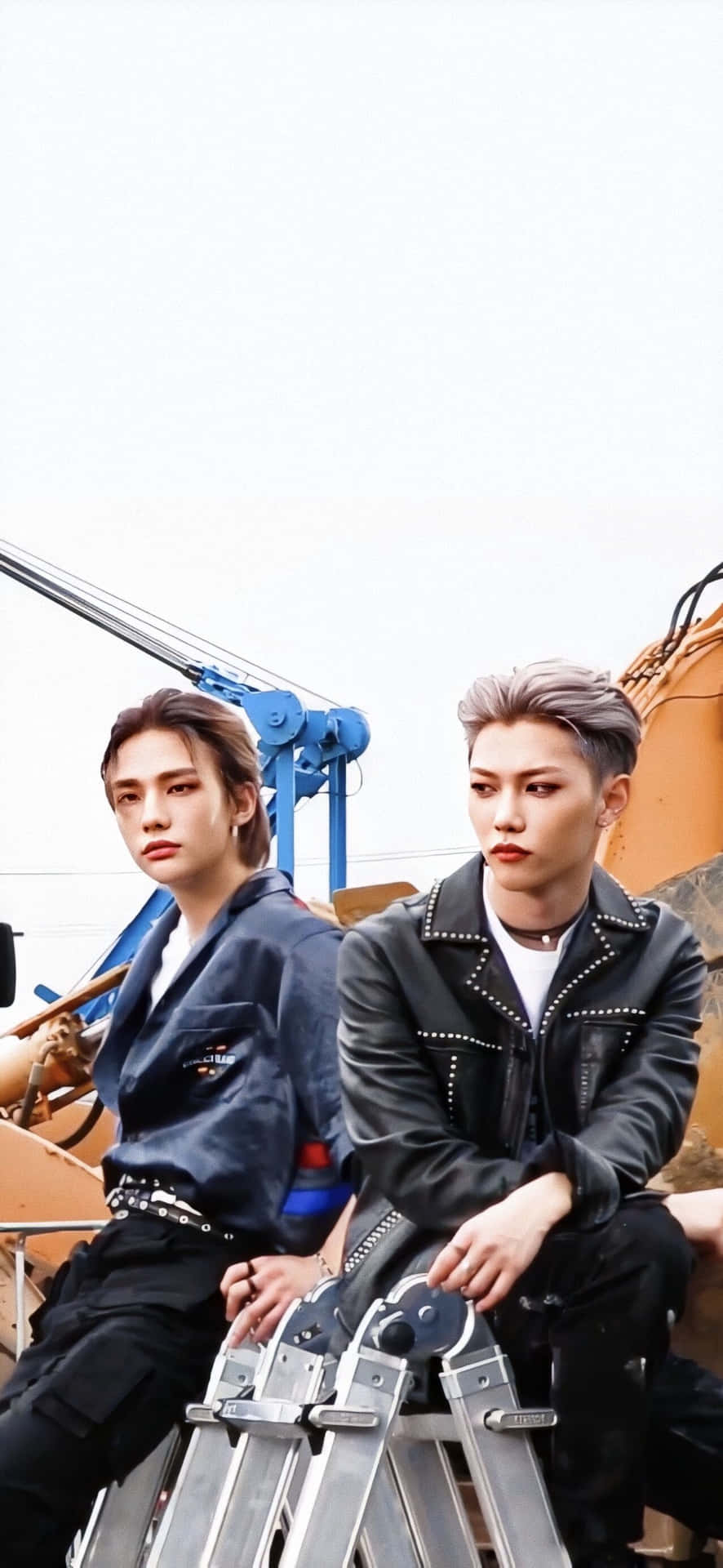 Felix From Stray Kids Looks Confident And Ready For Their Next Adventure. Background