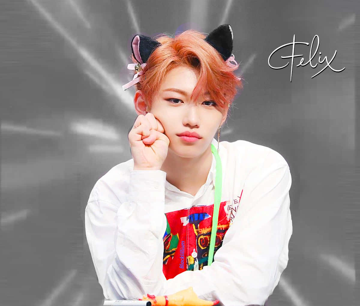 Felix Of Stray Kids Beaming With Confident Energy Background