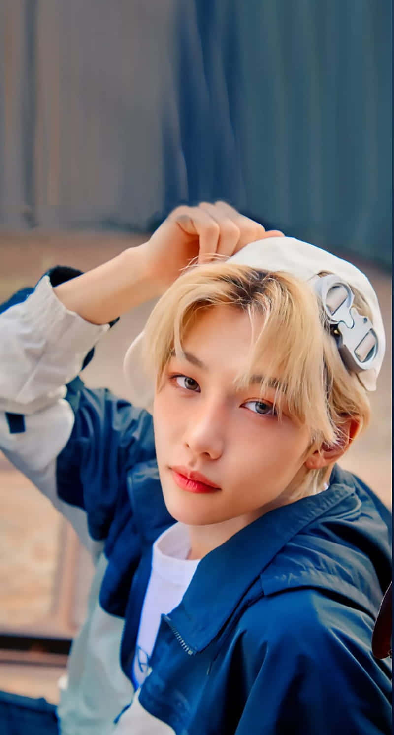 Felix Of Stray Kids Showing Off His Energy And Enthusiasm Background