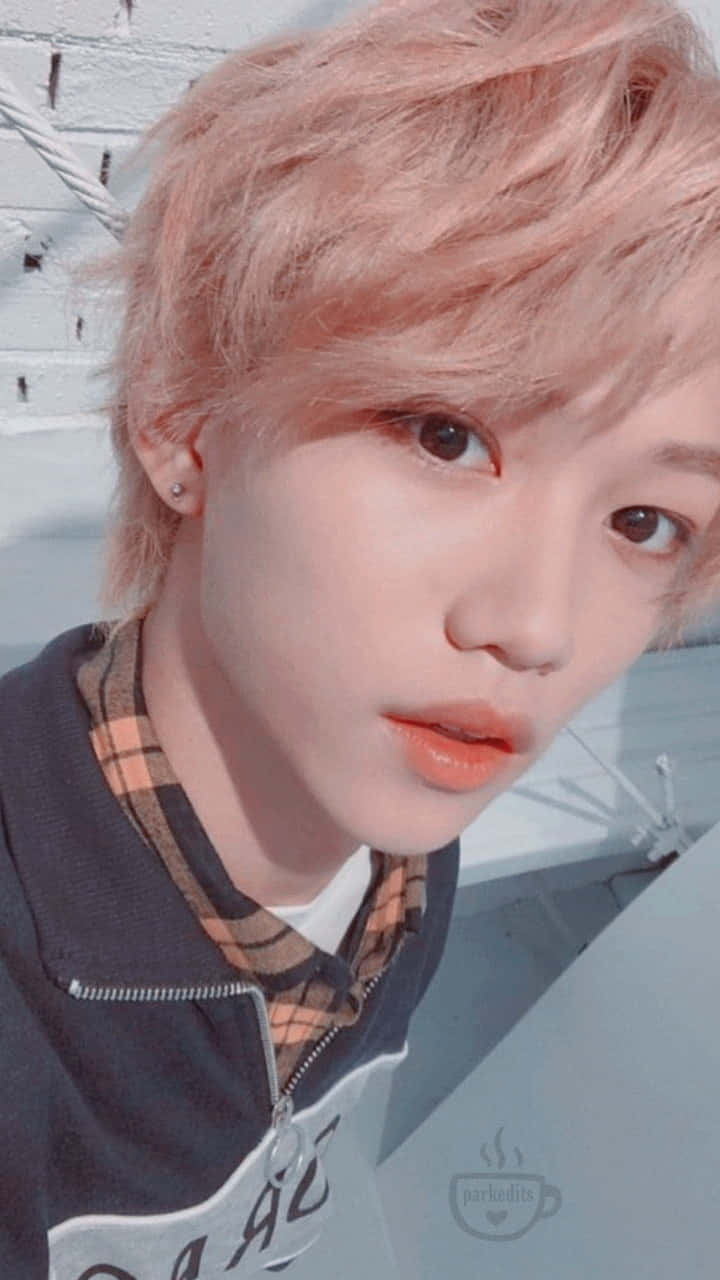 Felix Showing His Signature Mischievous Charm Background