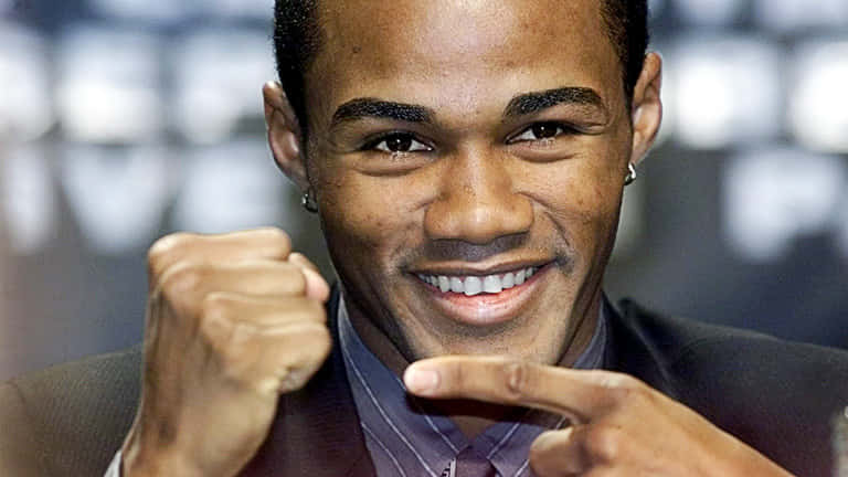 Felix Trinidad Pointing To His Fist Background