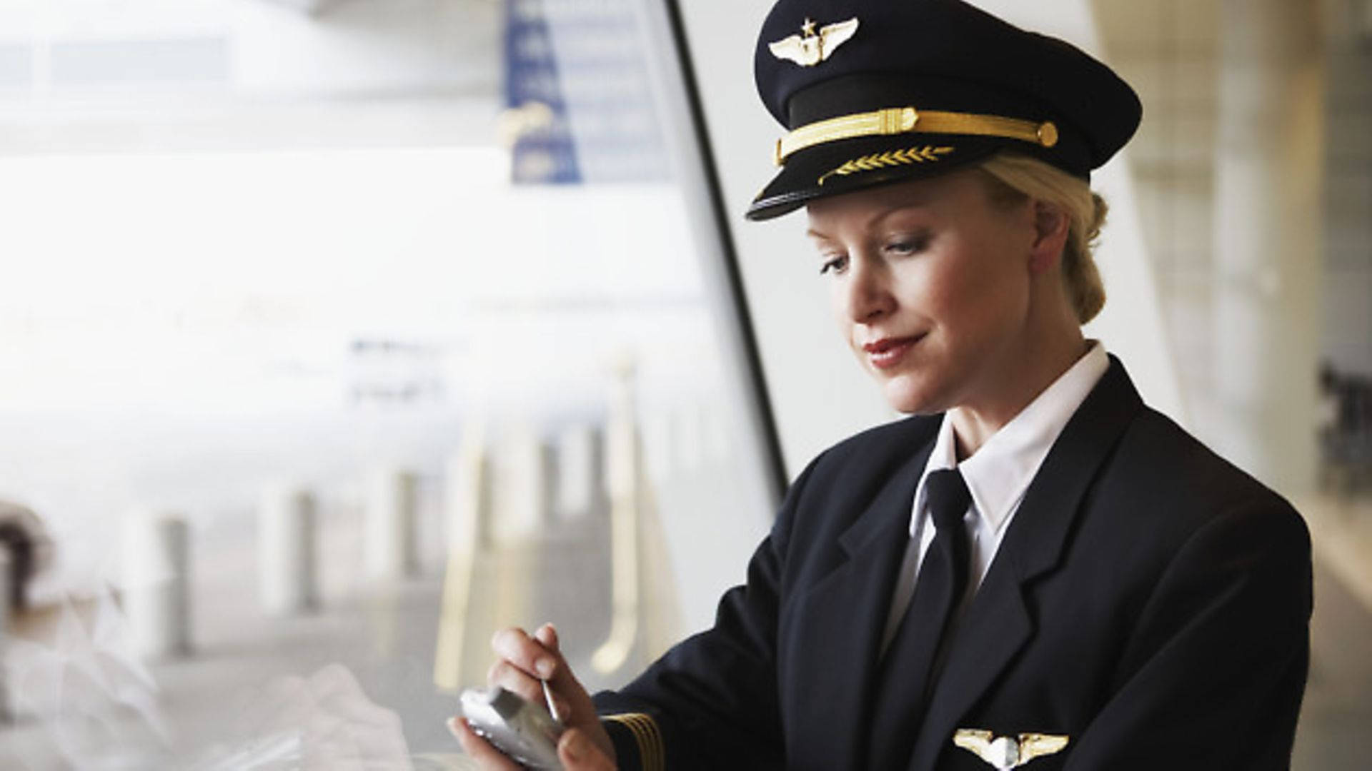 Female Aviator In Uniform Background