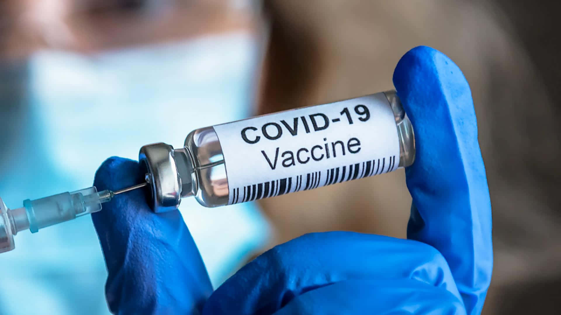 Female Doctor Holding Covid-19 Vaccine