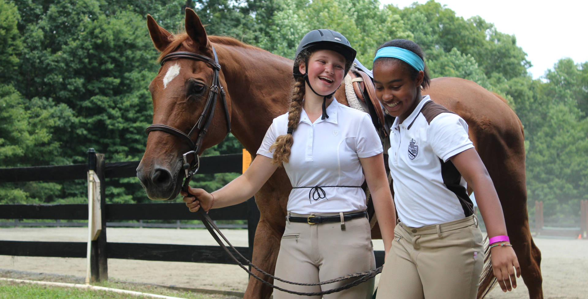 Female Equestrian Buddies With A Thoroughbred Horse Background