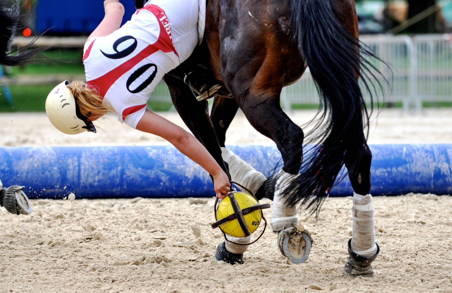 Female Equestrian Falling During Her Match Background