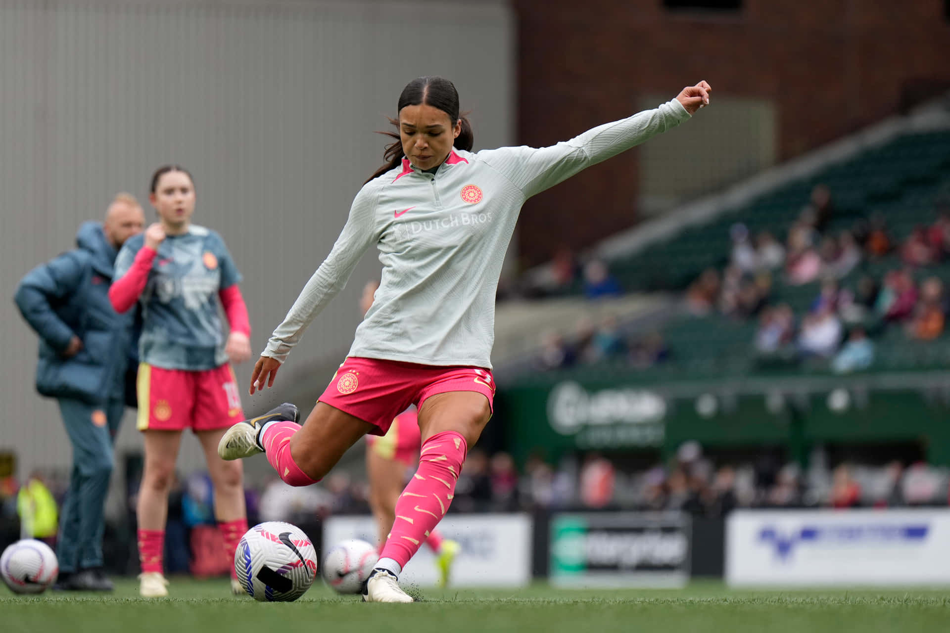 Female Footballer Practicing Ball Control Background