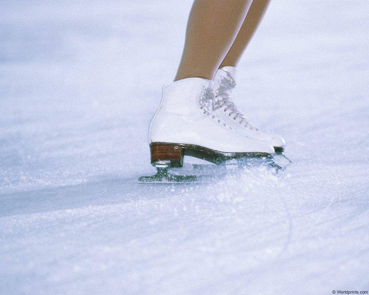 Female Ice Skating Shoes In Rink Background