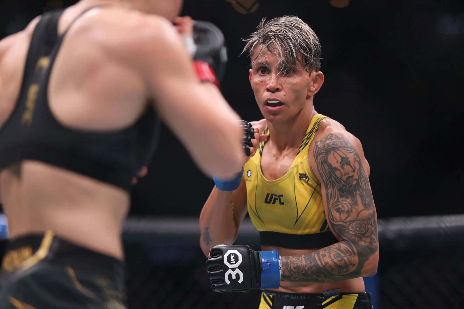 Female M M A Fighter Concentration During Match