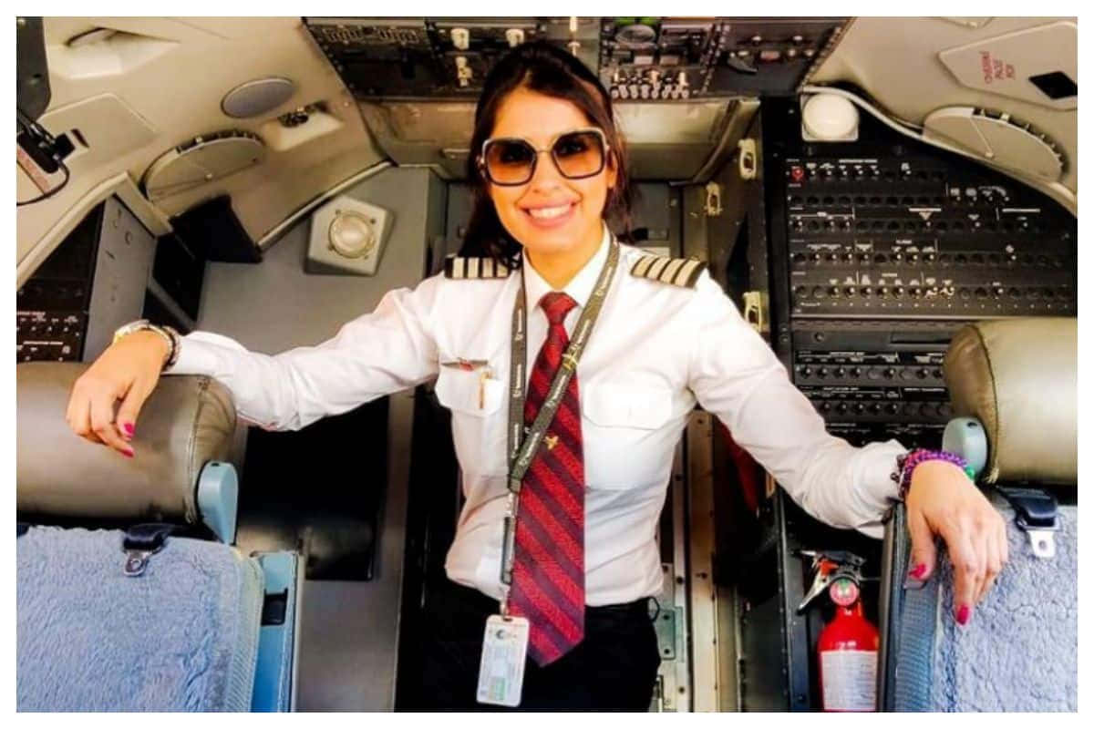 Female Pilot On Cockpit Background