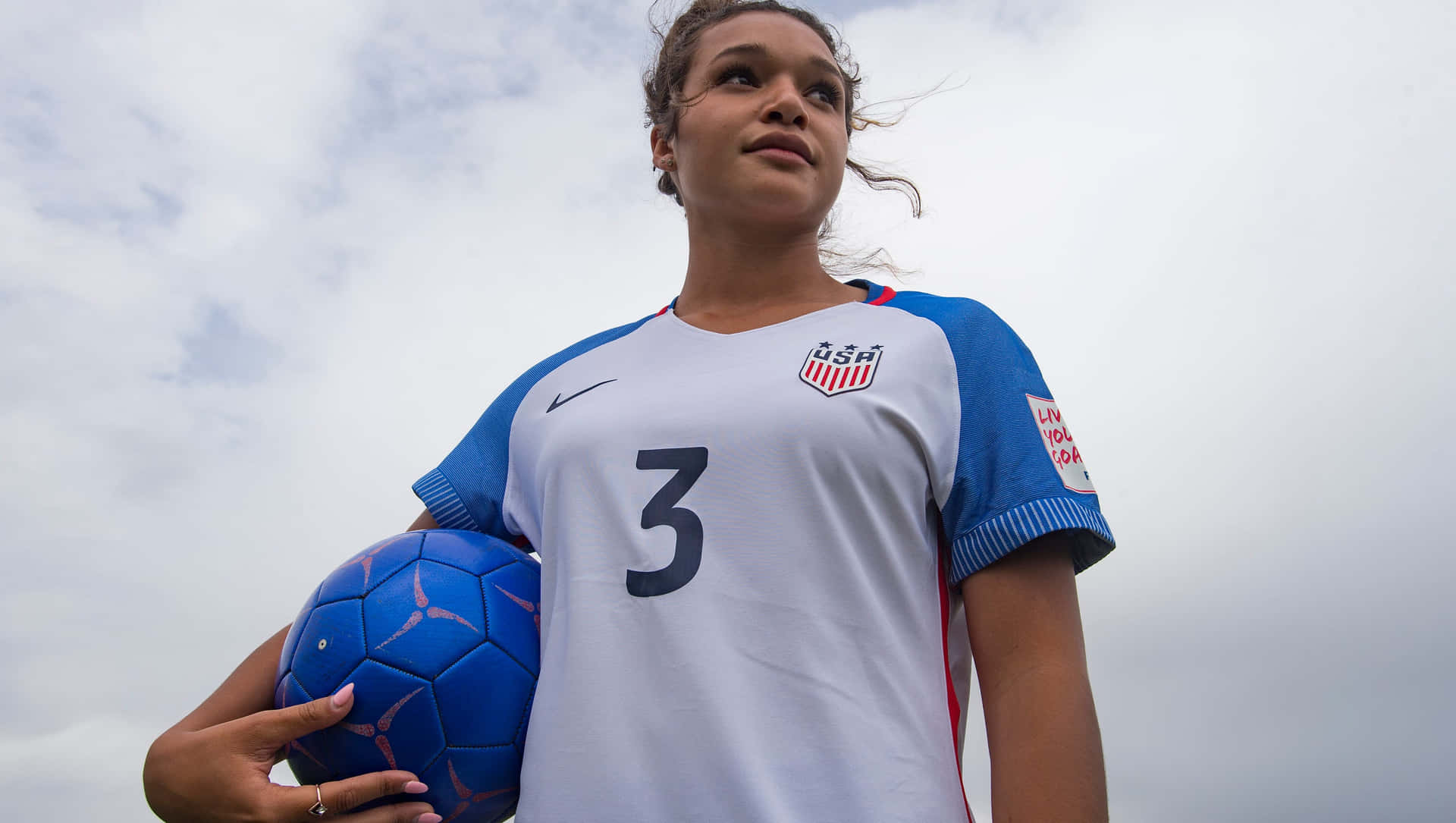 Female Soccer Player Proud Pose Background