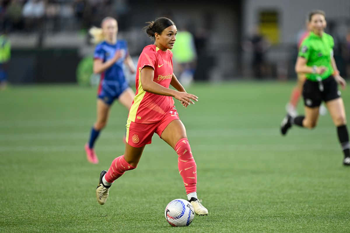 Female Soccer Playerin Actionon Field.jpg Background