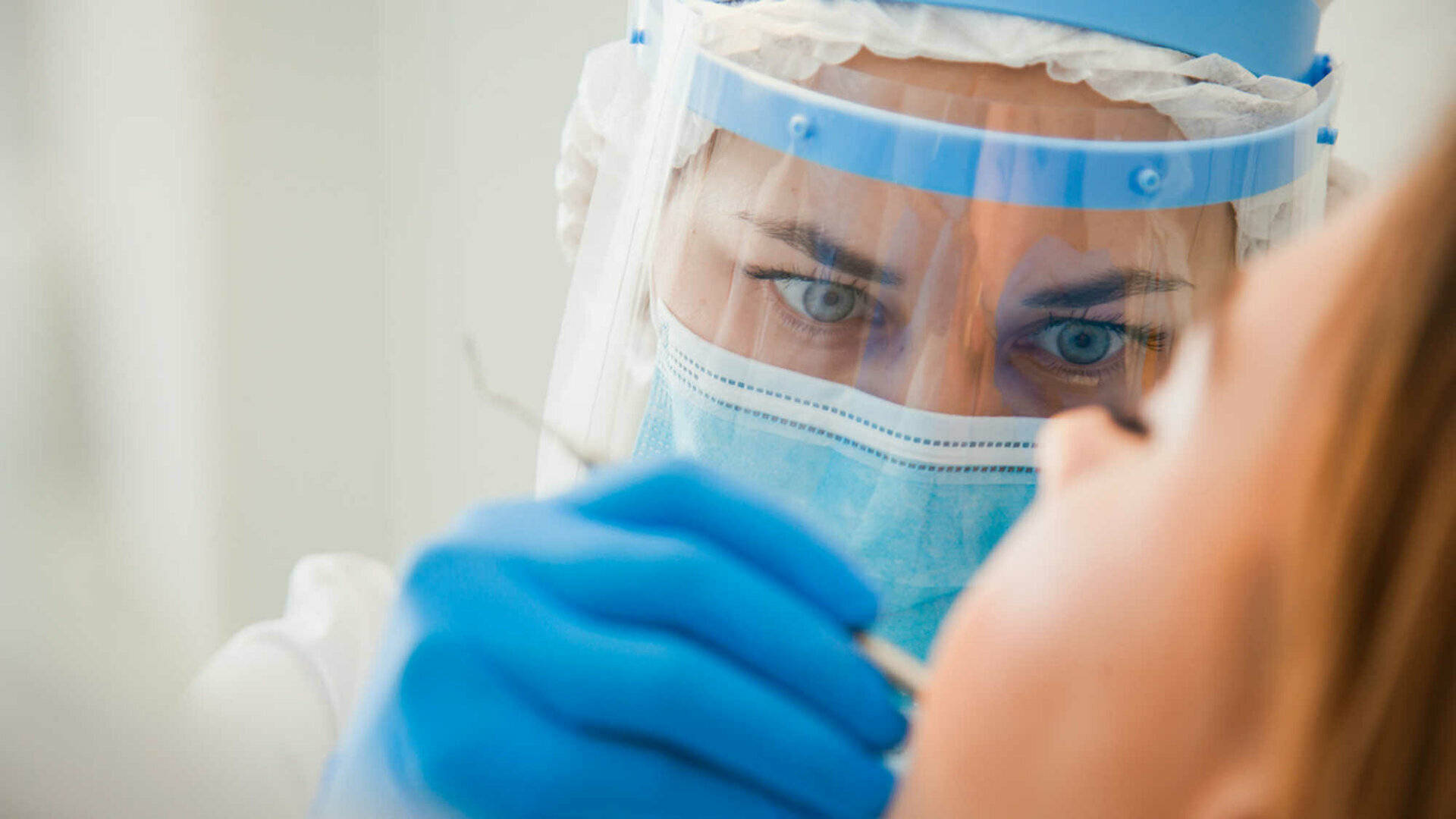 Female Surgeon Concentrating On Operation