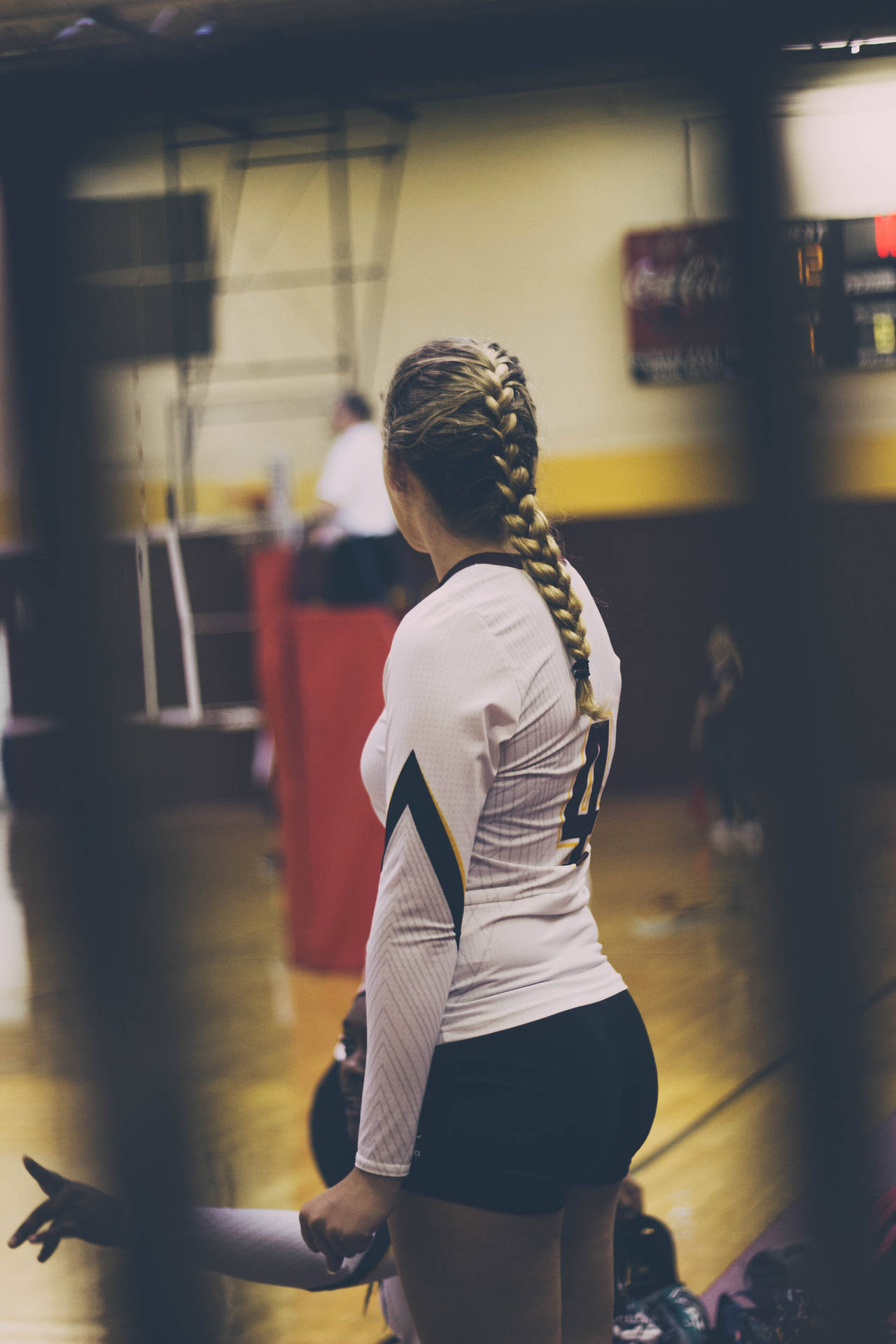 Female Volleyball Player On Court Background
