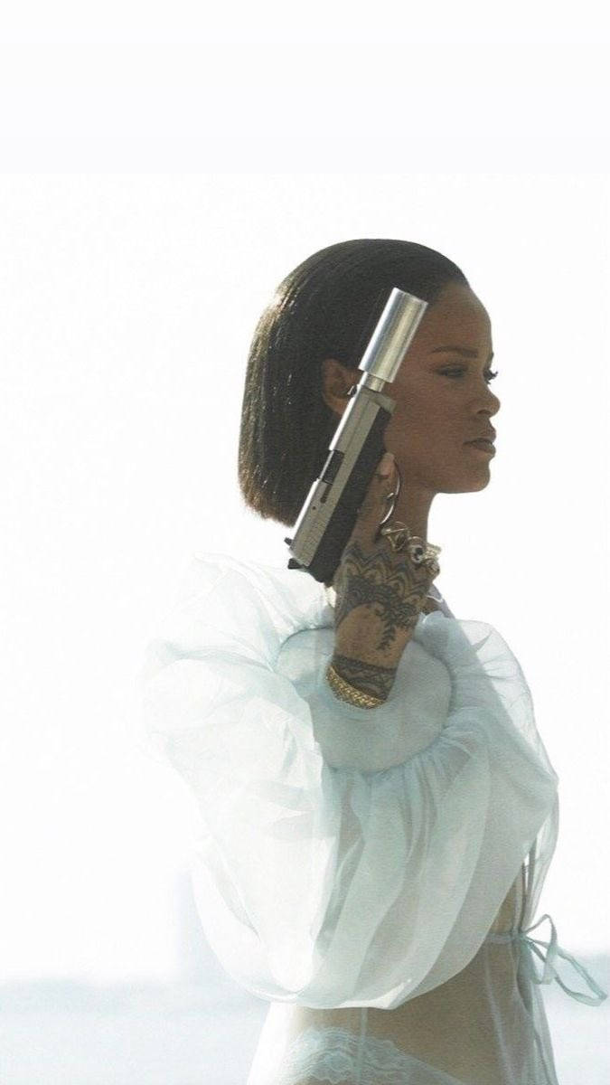 Fenty Rihanna Holding A Gun Background