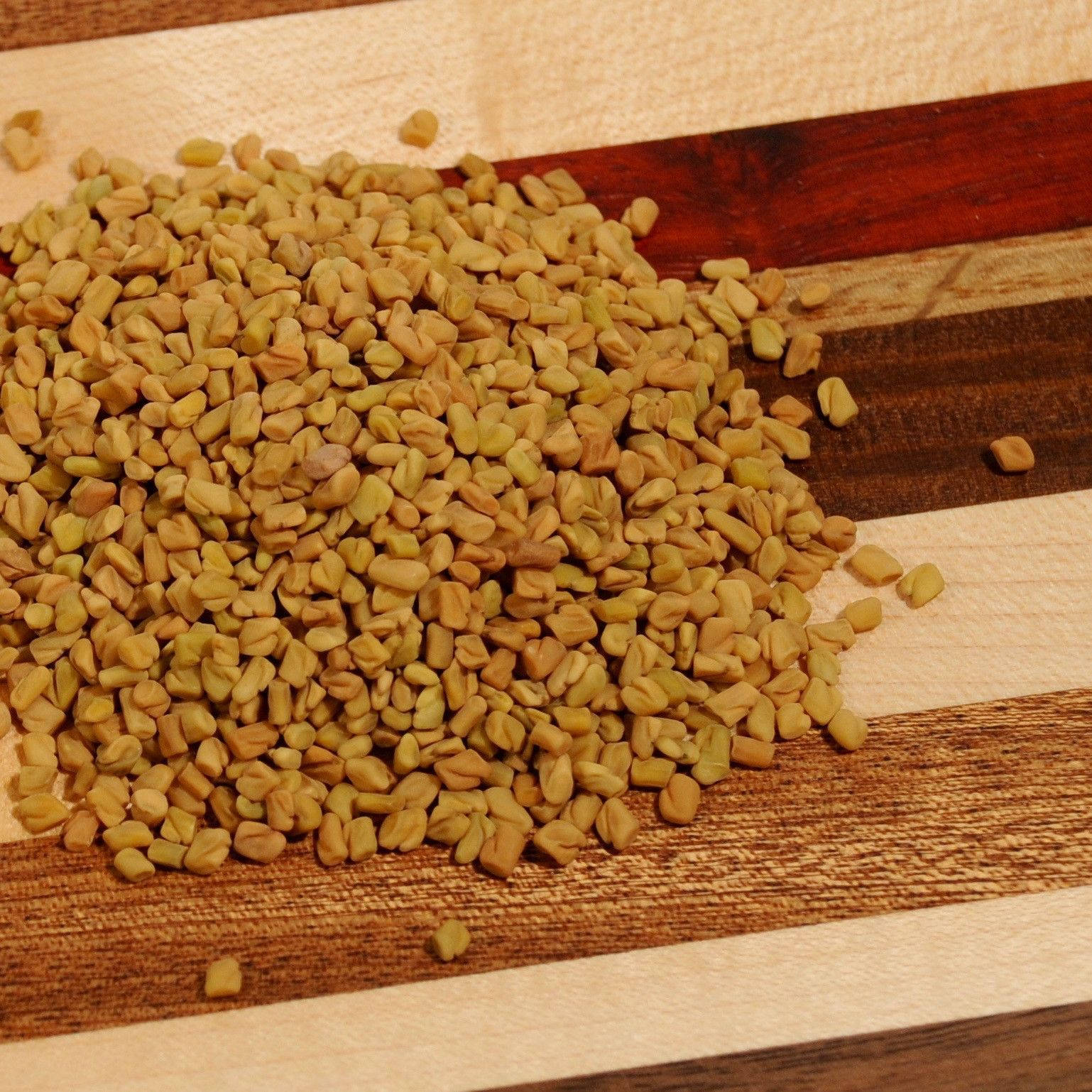 Fenugreek Seeds On Wood Background