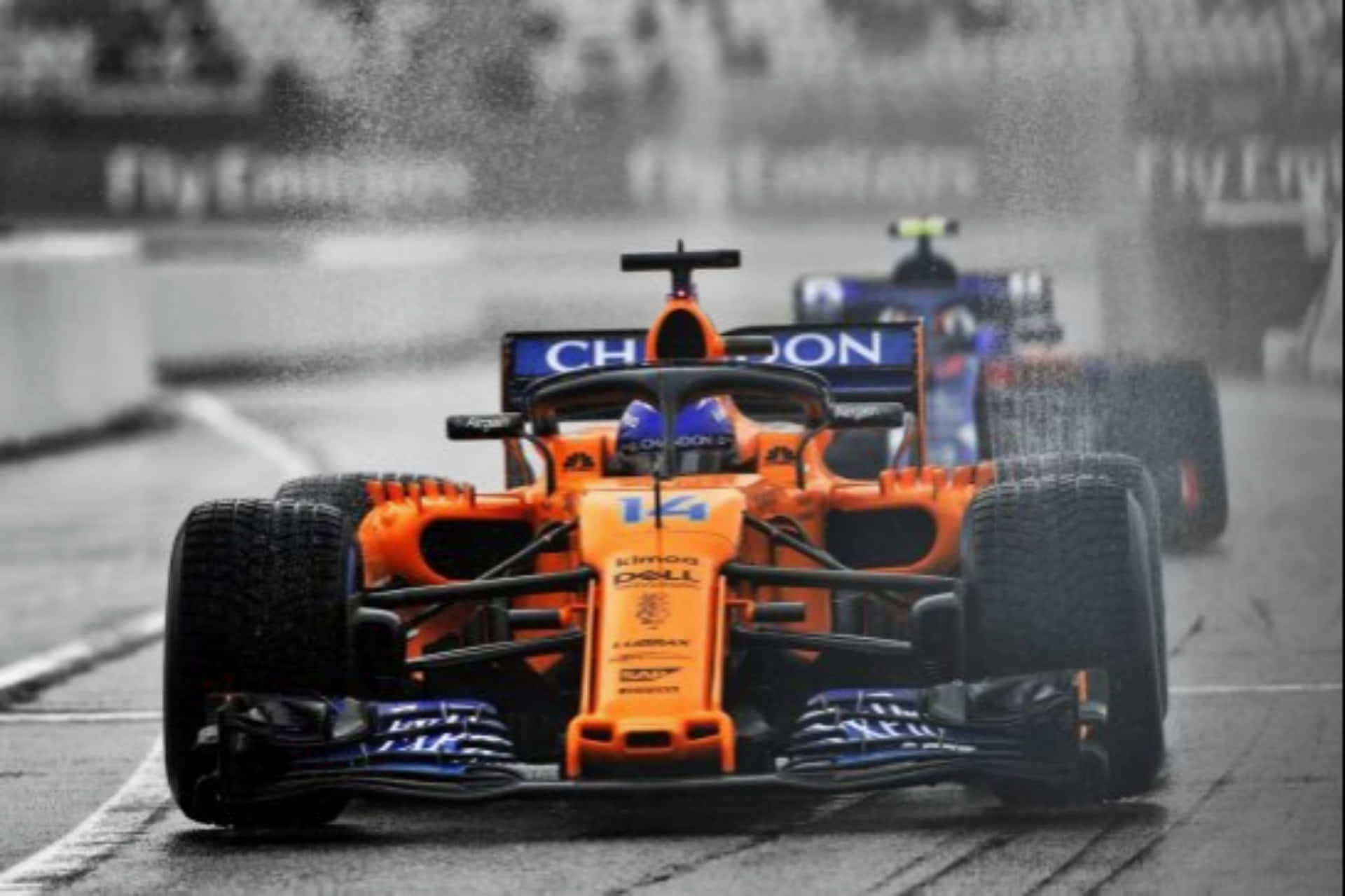 Fernando Alonso Driving A Mclaren Formula 1 Car Background