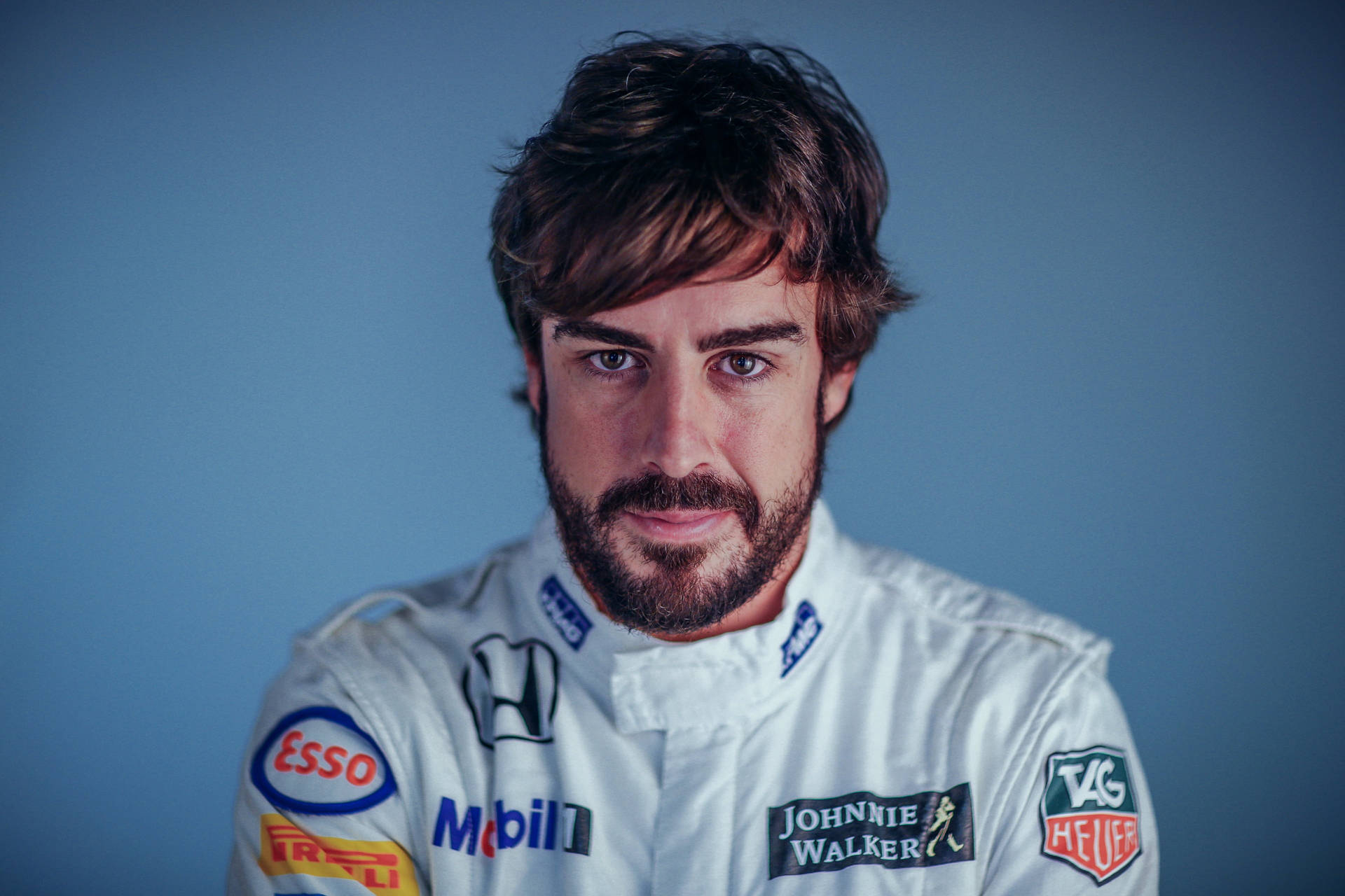 Fernando Alonso Geared Up In His Bright White Racing Suit Background