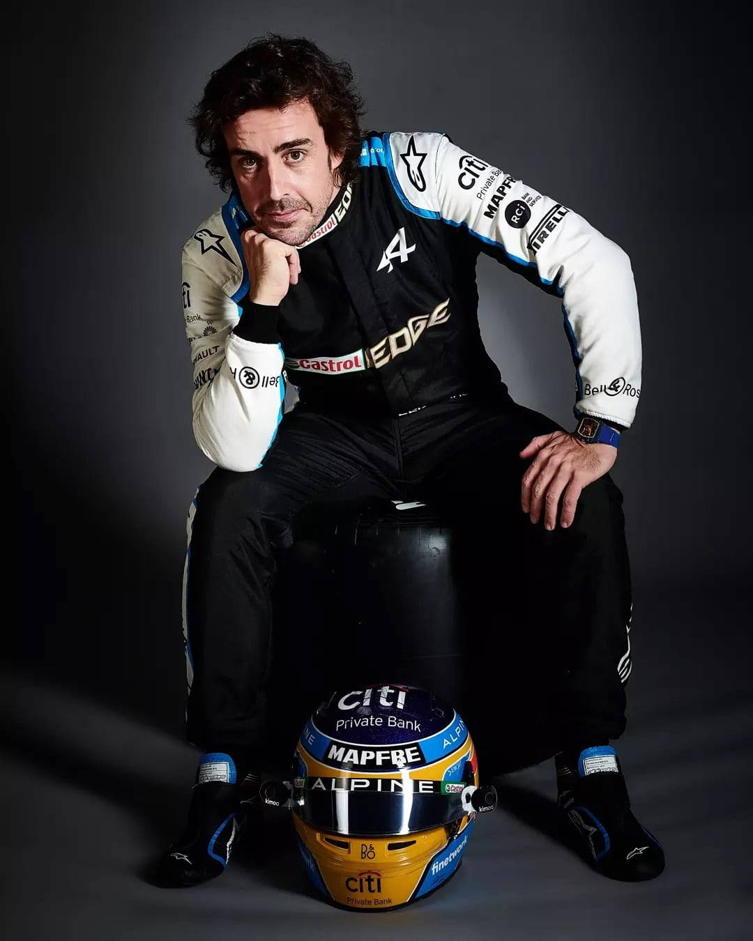 Fernando Alonso Sitting With Helmet Background