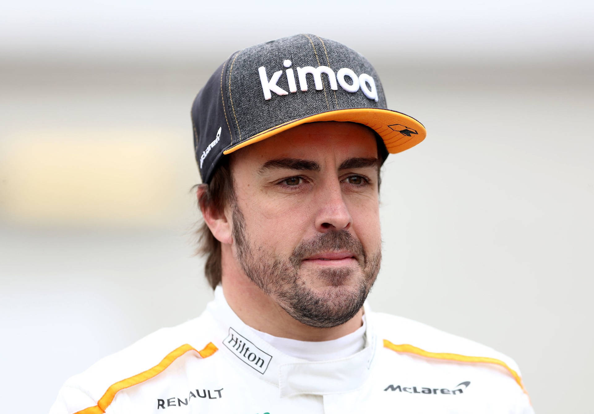 Fernando Alonso Sporting Kimoa Cap In A Close-up View Background