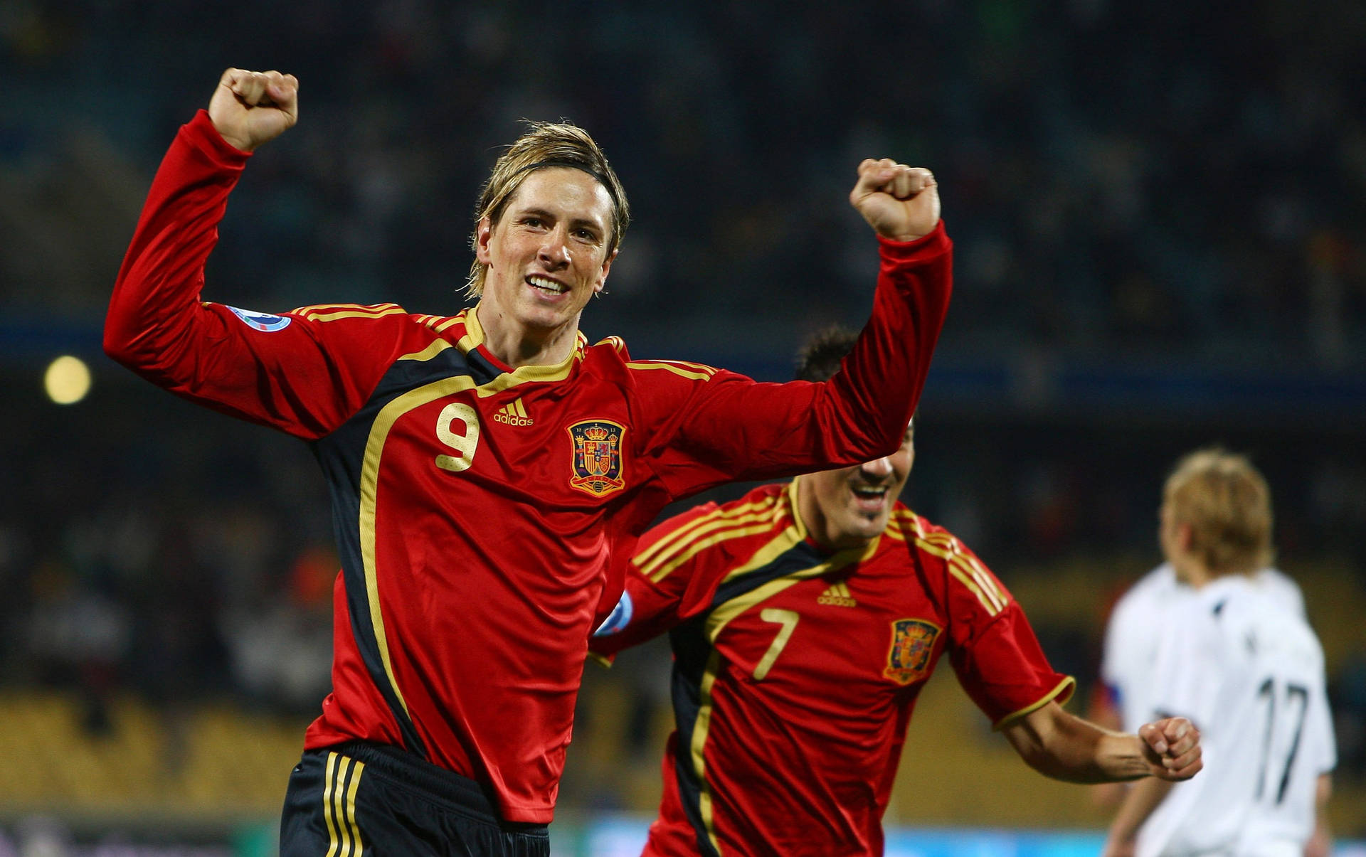 Fernando Torres And David Villa - Striking Legends Of Spanish Football Background