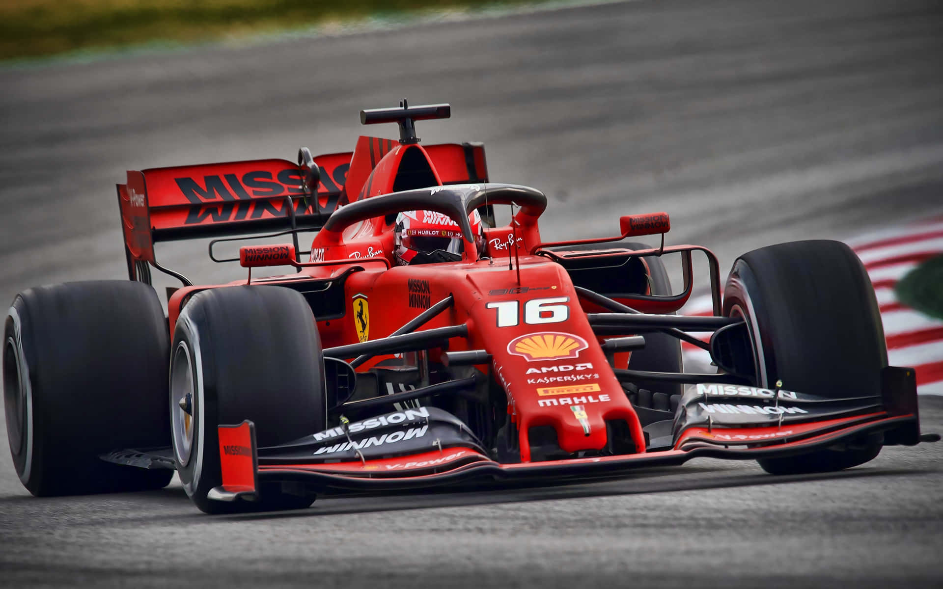 Ferrari F1 Car Driving On A Track Background