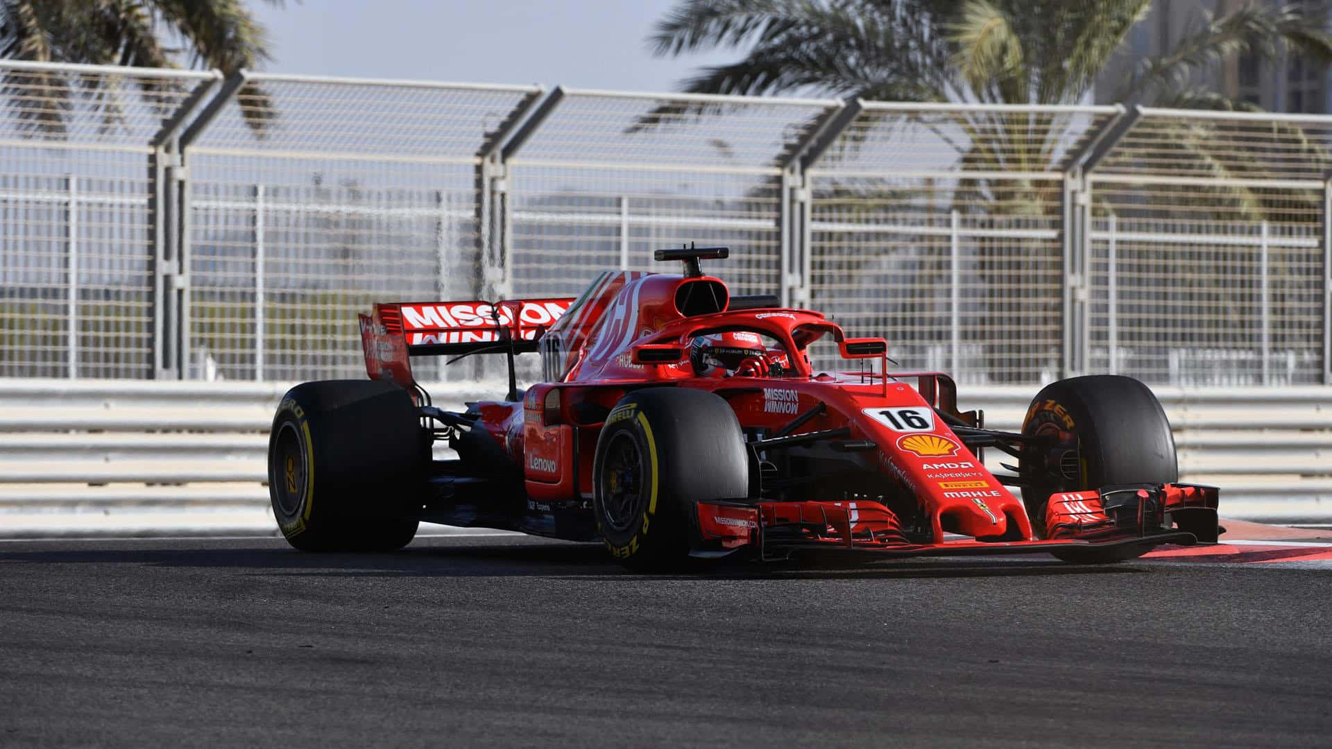 Ferrari F1 Car Driving On A Track Background