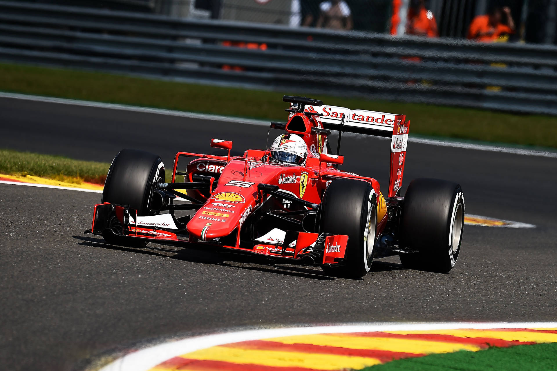 Ferrari F1 Car Driving On A Track Background