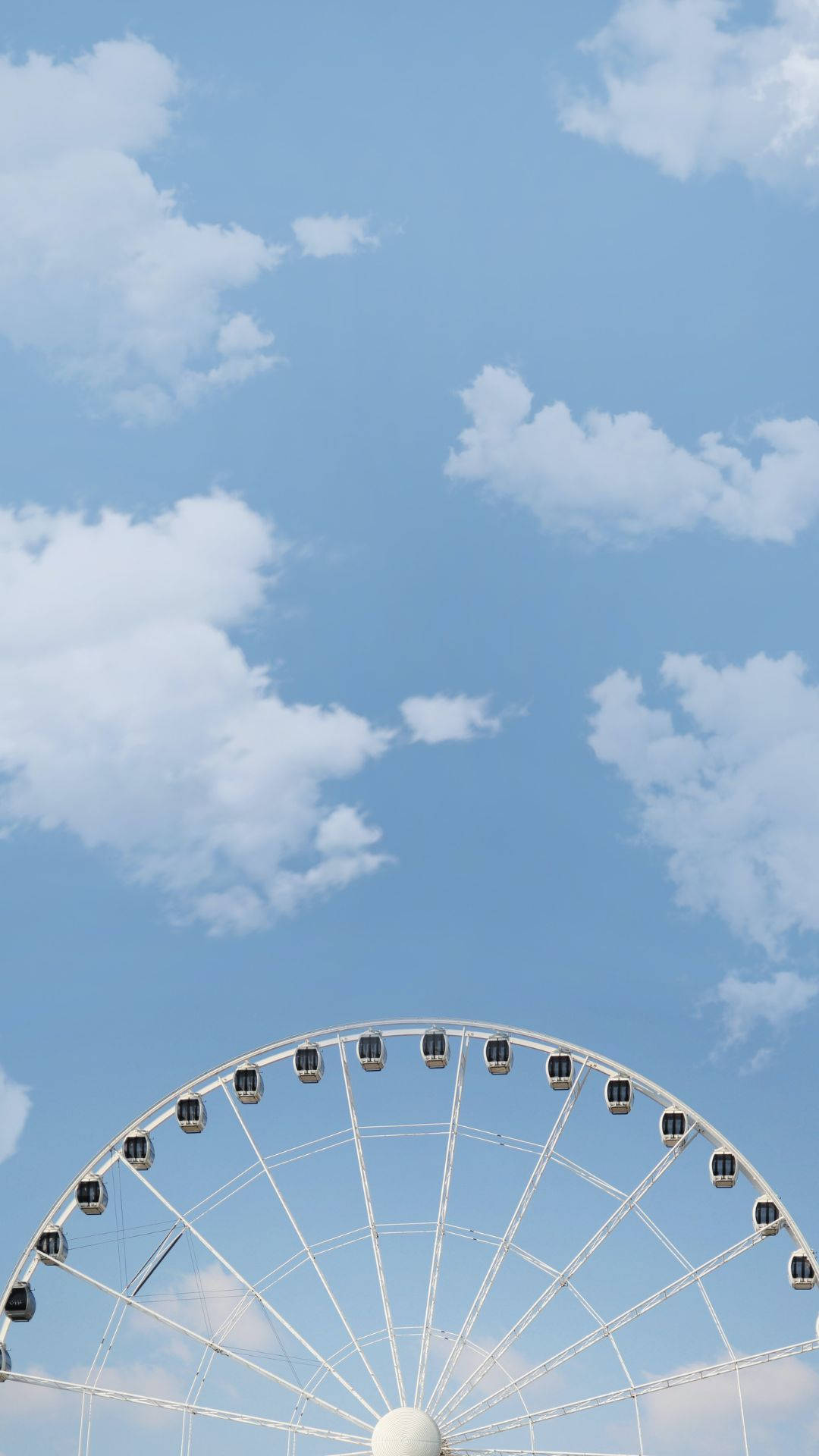 Ferris Wheel And Baby Blue Sky Background