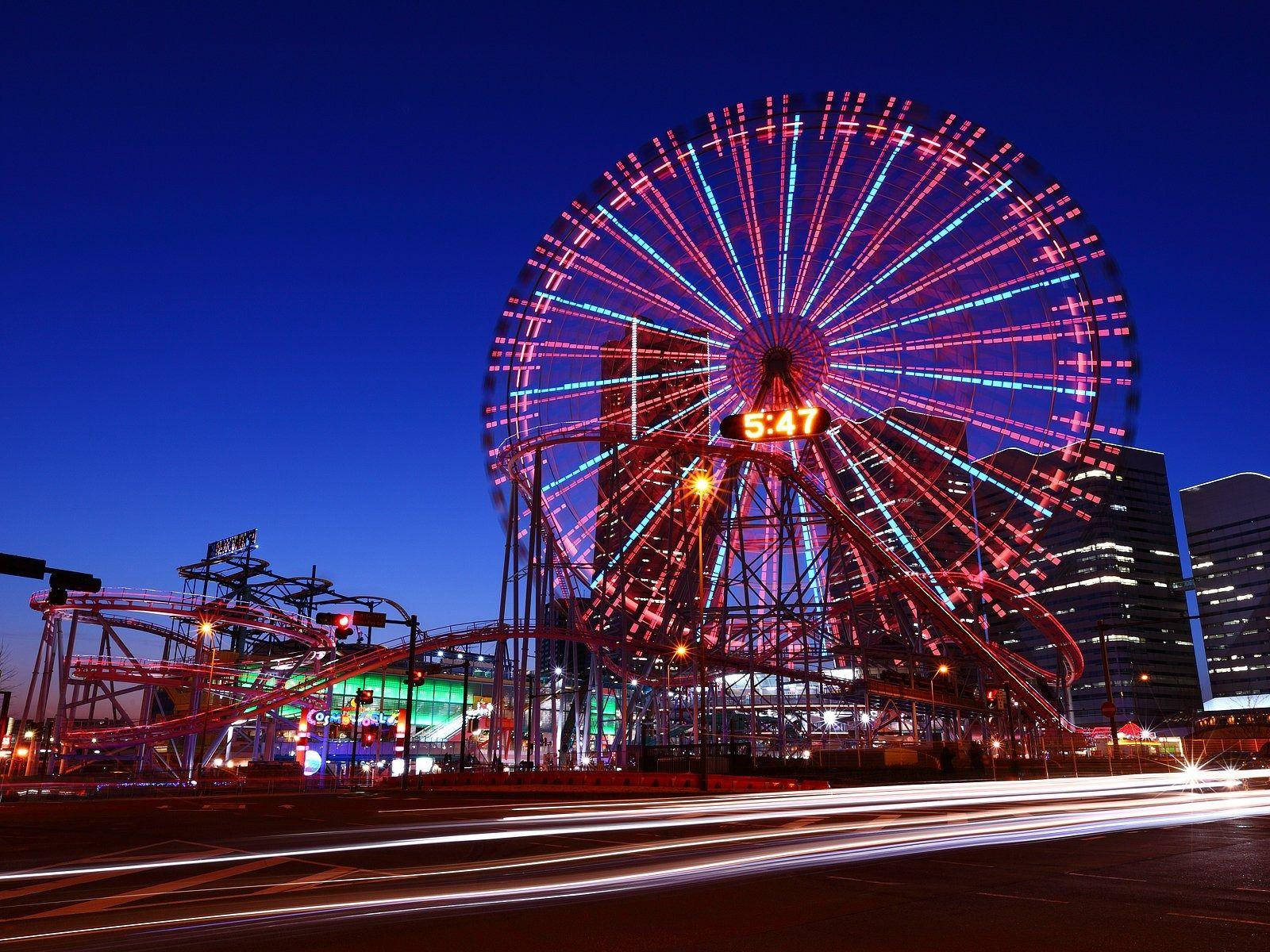 Ferris Wheel At Amusement Park Background