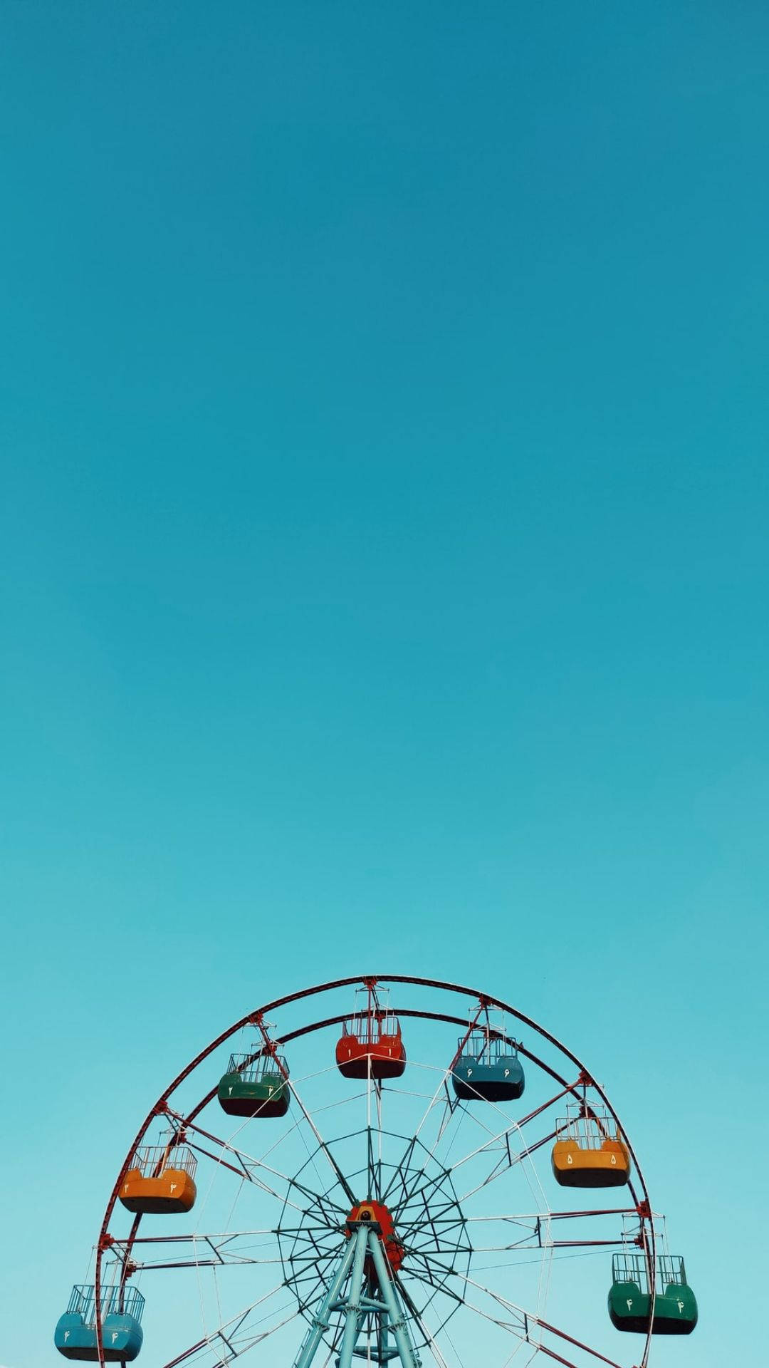Ferris Wheel On Baby Blue Sky Background