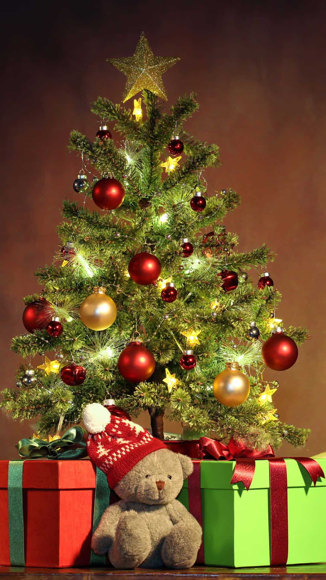 Festive Christmas Tree With Giftsand Teddy Bear.jpg Background