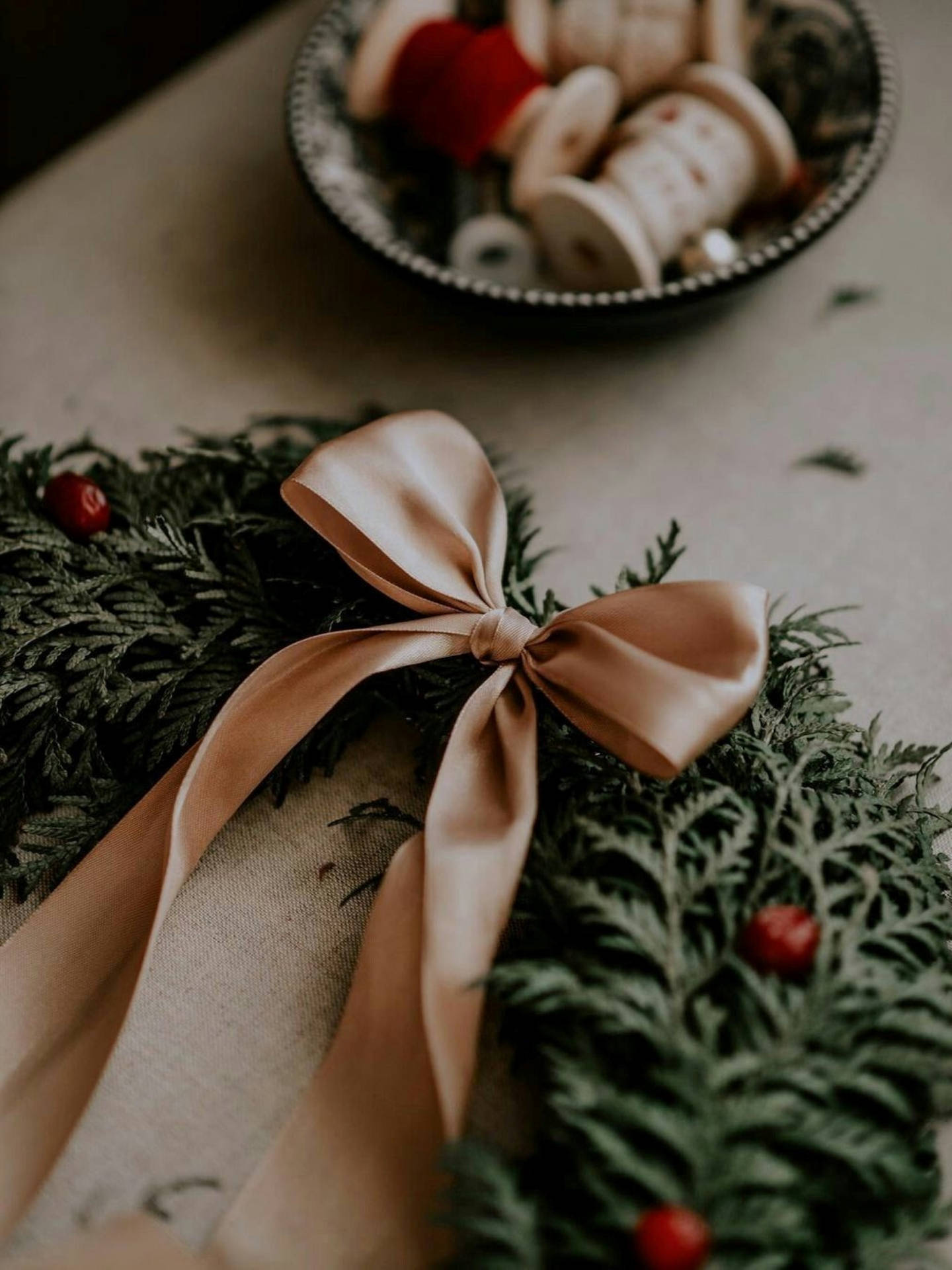 Festive Serenity: A Christmas Aesthetic Wreath Adorned With A Ribbon