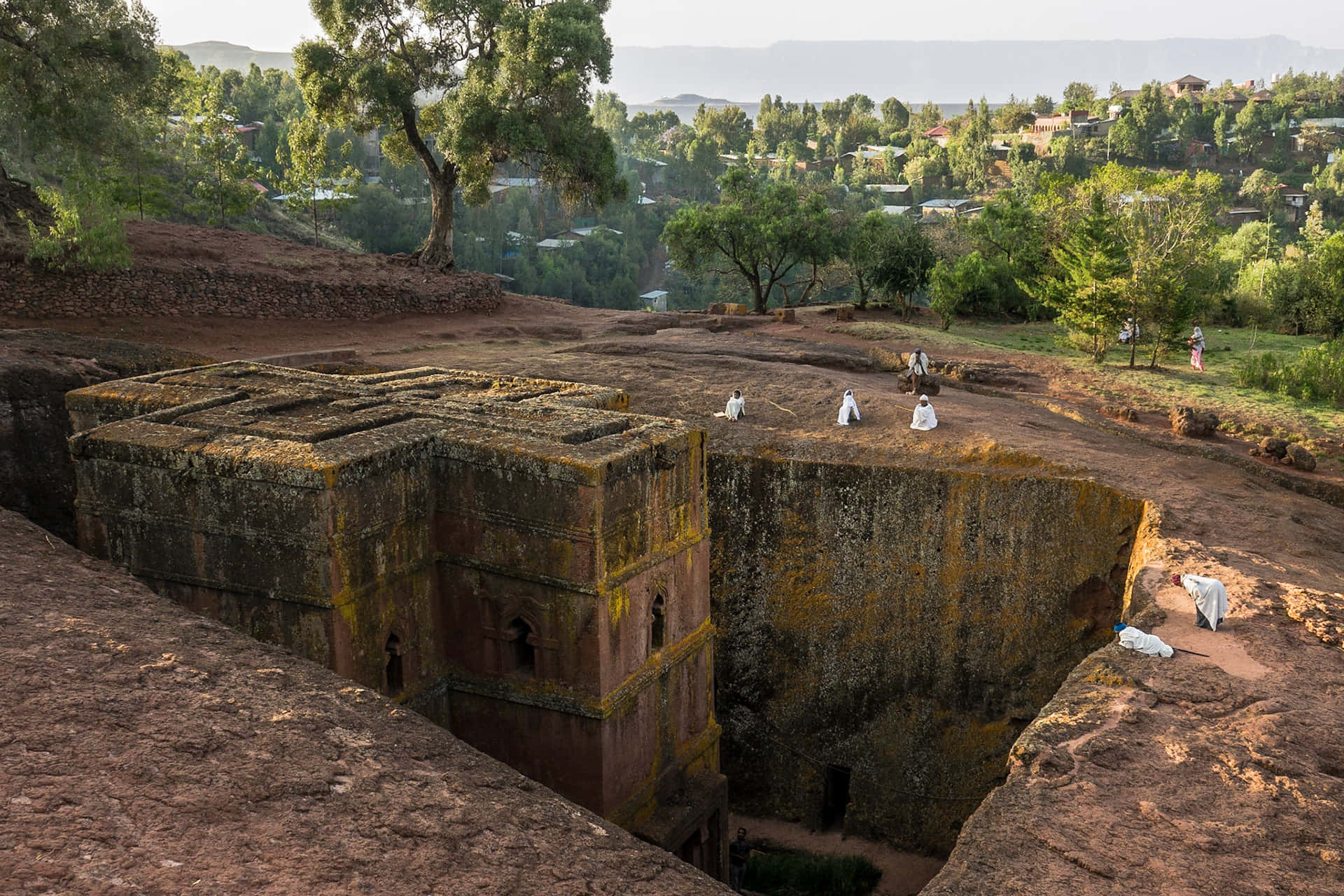 Few Pilgrims Scattered In Lalibela's St. George Church Background
