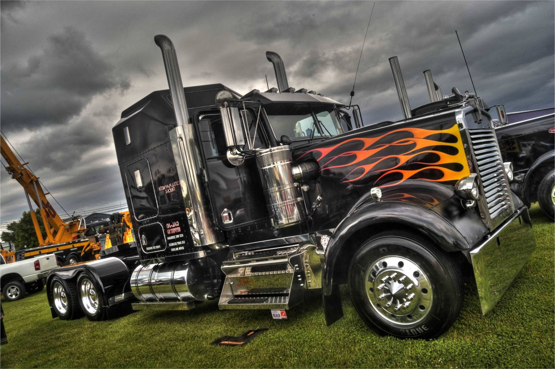 Fiery Kenworth Truck In Motion Background